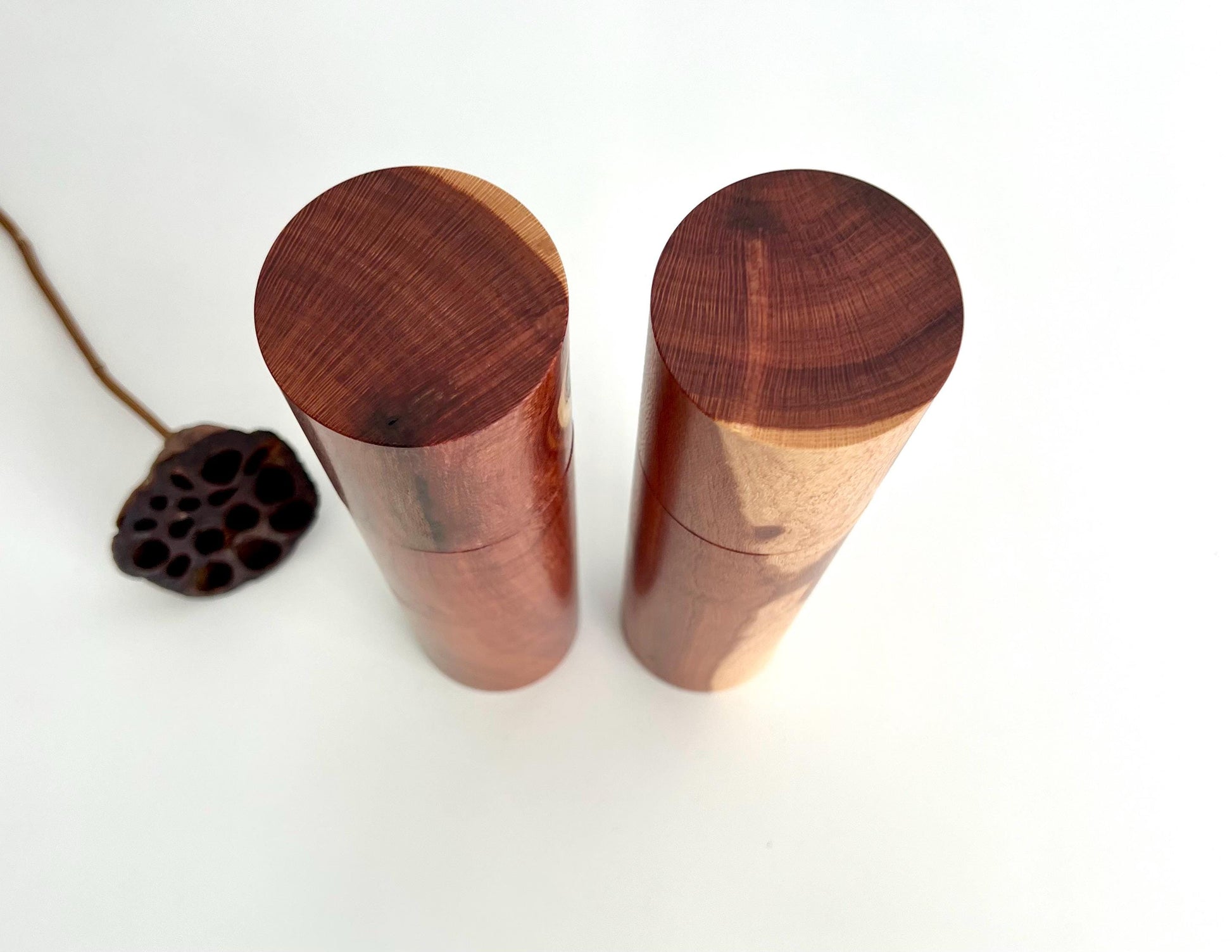 Birdseye view of wooden cylindrical shape salt and pepper grinders made from Australian Needle Wood timber