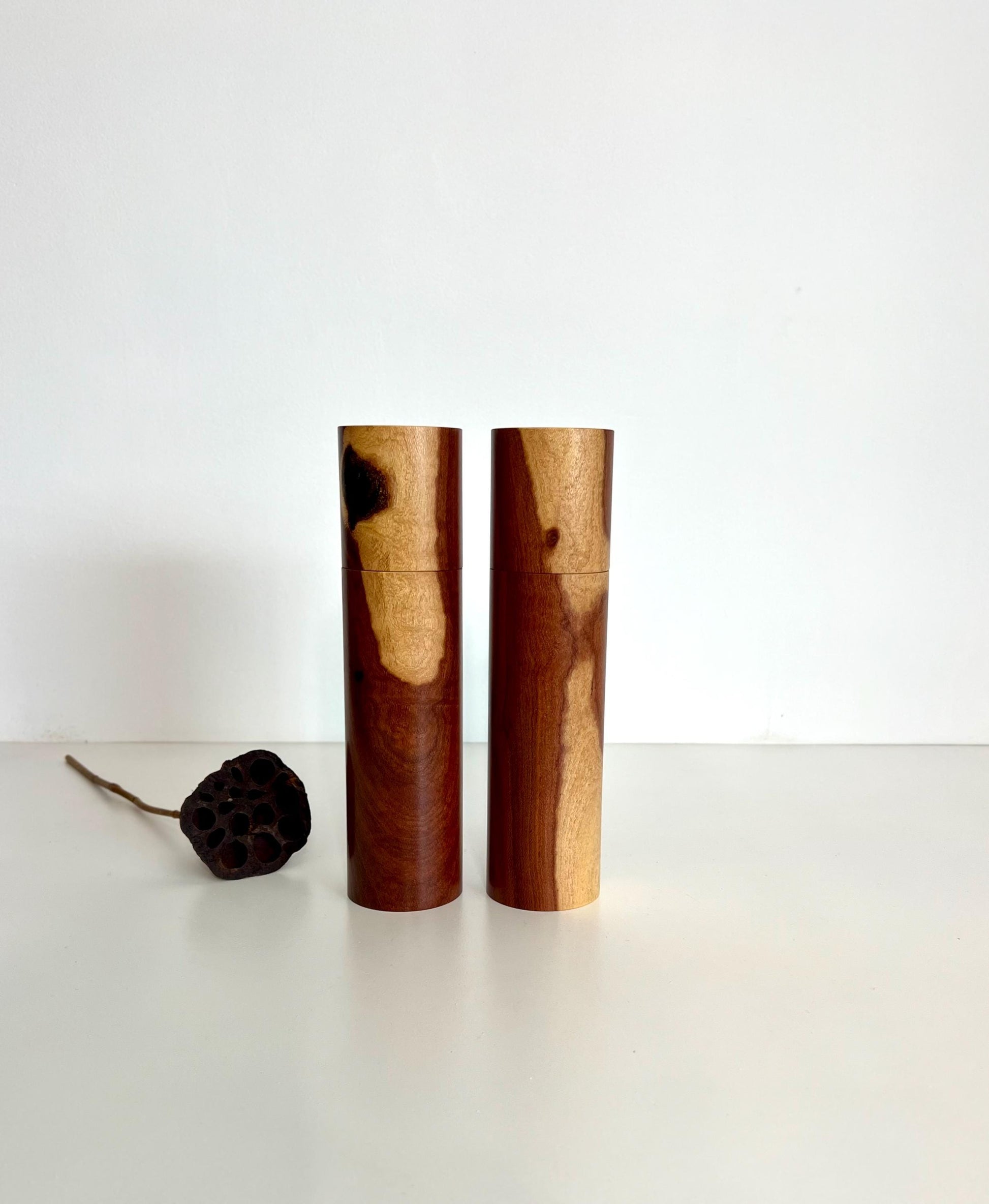 Wooden cylindrical shape salt and pepper grinders made from Needlewood timber