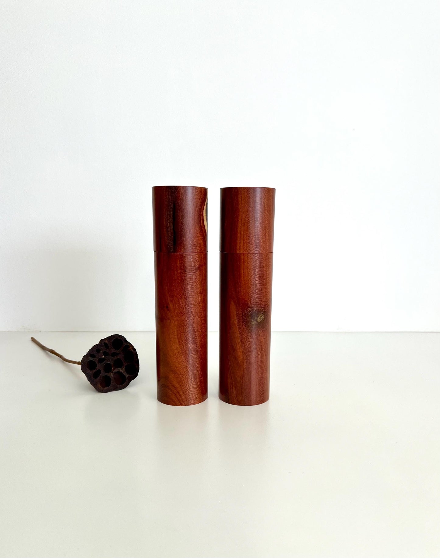 Wooden cylindrical shape salt and pepper grinders made from Needlewood timber