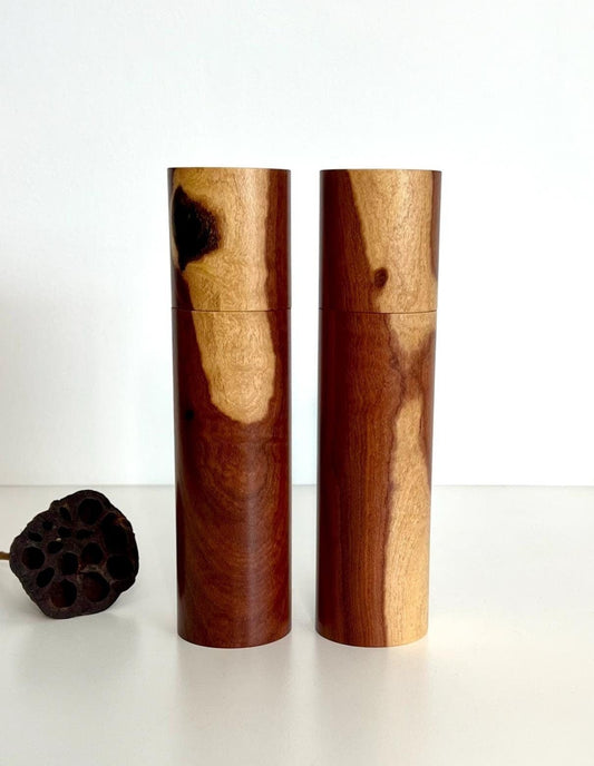 Wooden cylindrical shape salt and pepper grinders made from Needlewood timber