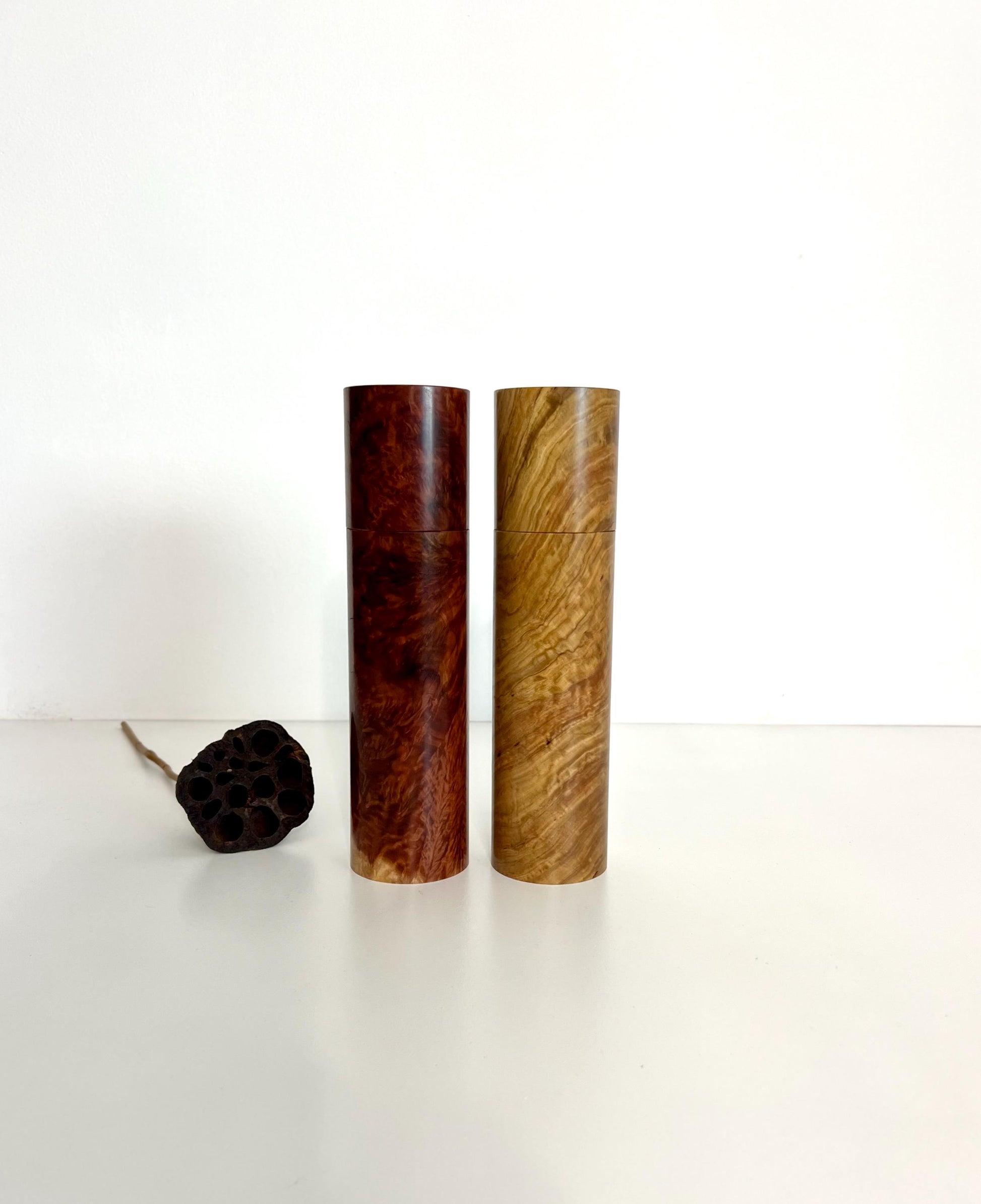 Wooden cylindrical shape salt and pepper grinders made from Red Mallee Burl and Bimble Box Burl timbers