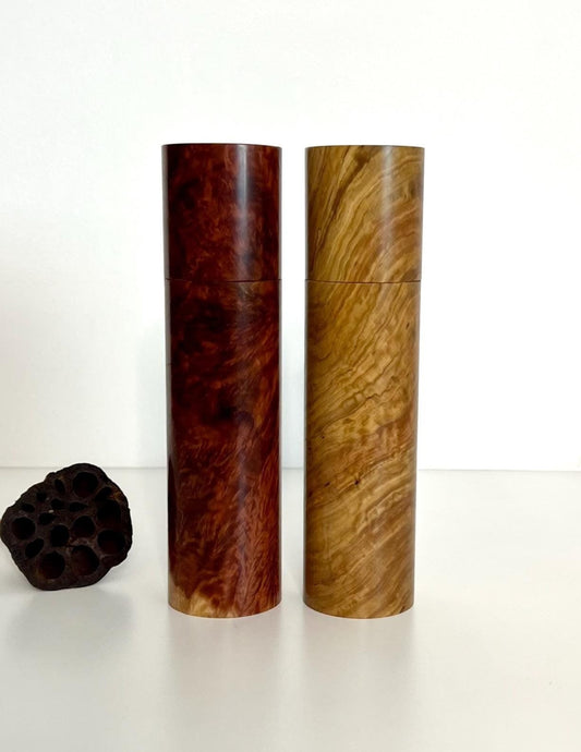 Wooden cylindrical shape salt and pepper grinders made from Red Mallee Burl and Bimble Box Burl timbers