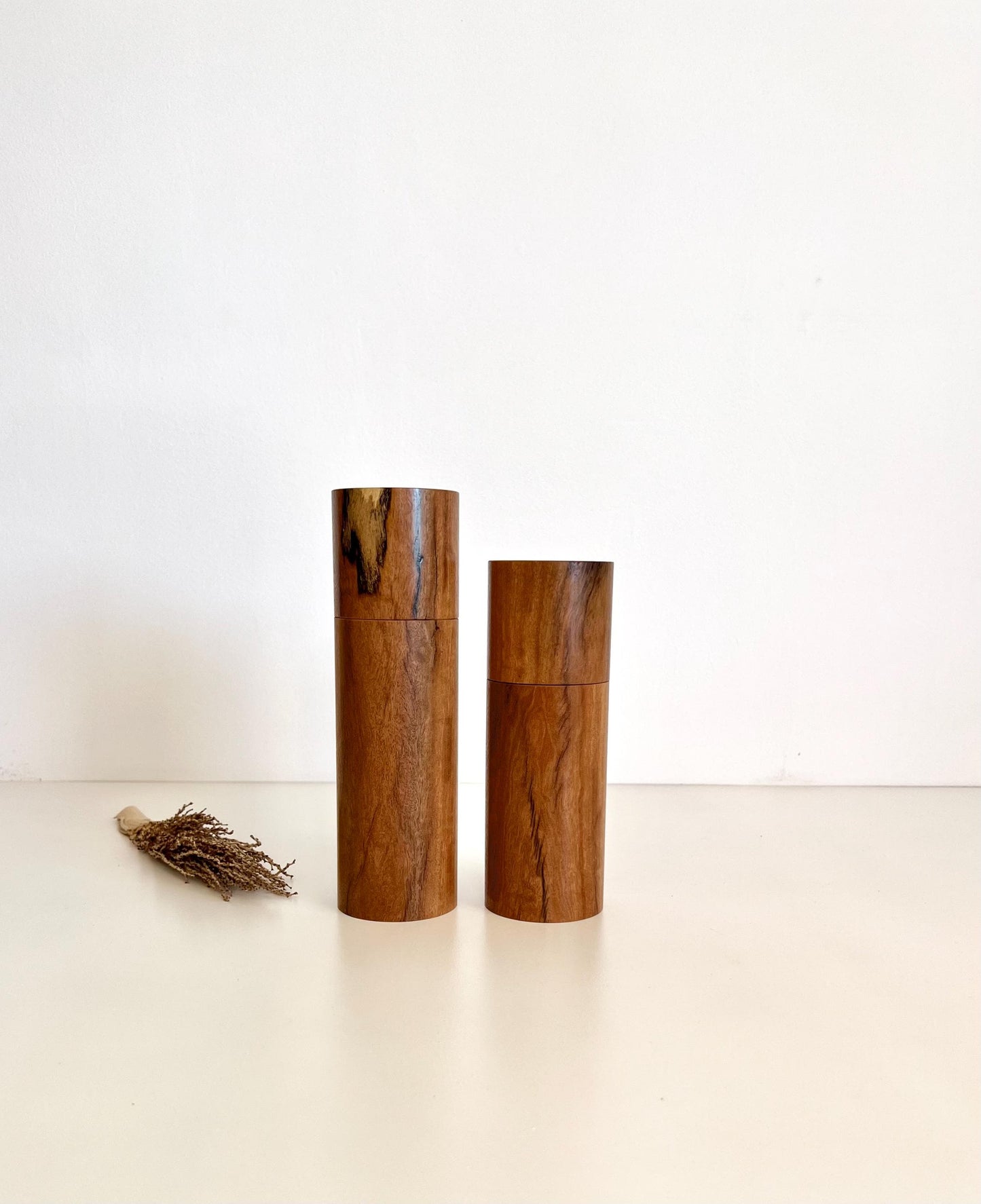 Wooden cylindrical shape salt and pepper grinders made from Wandoo timber