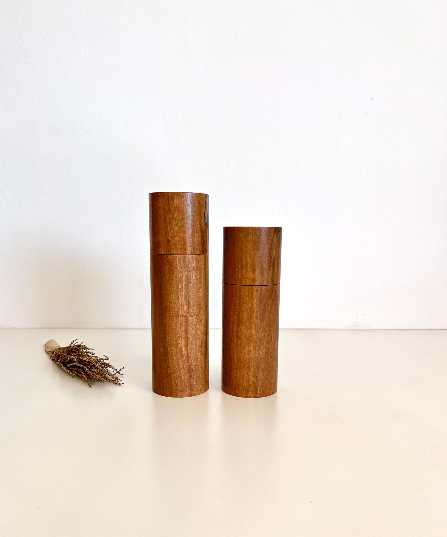 Wooden cylindrical shape salt and pepper grinders made from Wandoo timber