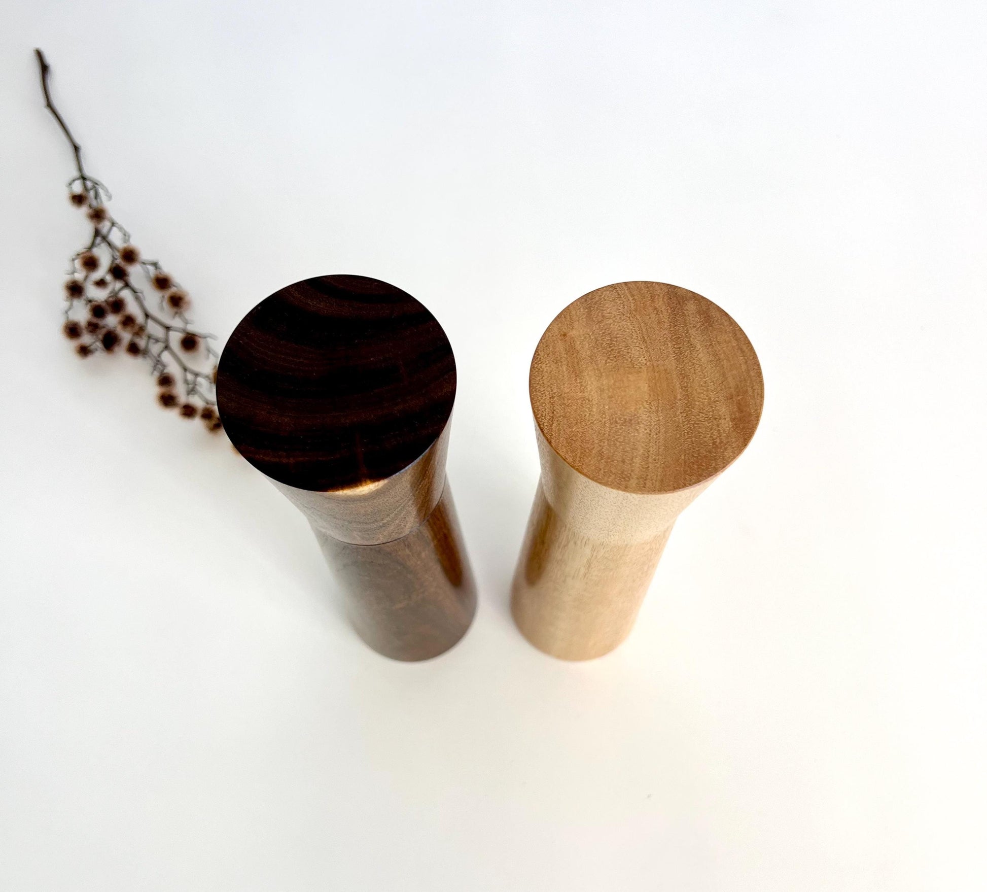 Birdseye view of wooden cylindrical shape salt and pepper grinders made from Australian Western Myall and Blue gum timbers.