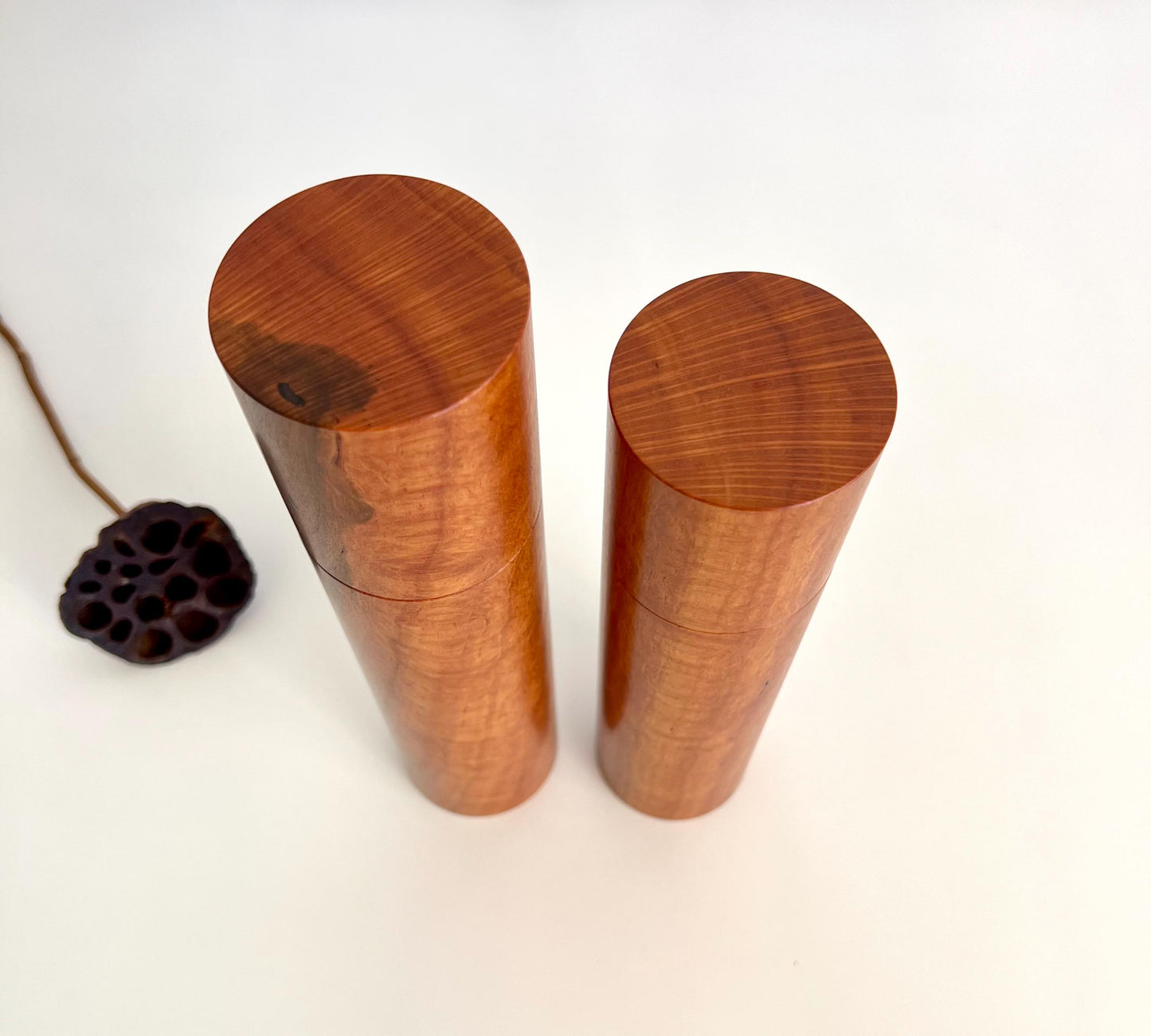 Birdseye view of wooden cylindrical shape salt and pepper grinders made from Australian lace sheoak timber