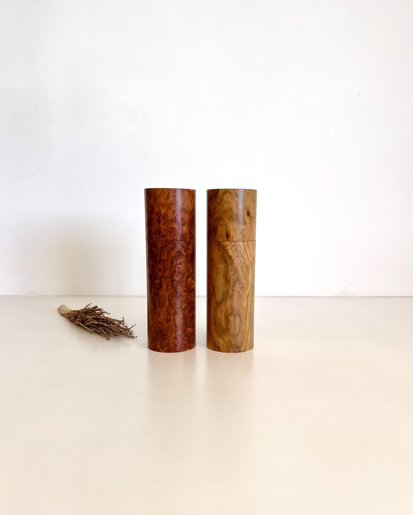 Wooden cylindrical shape salt and pepper grinders made from Australian burl timber