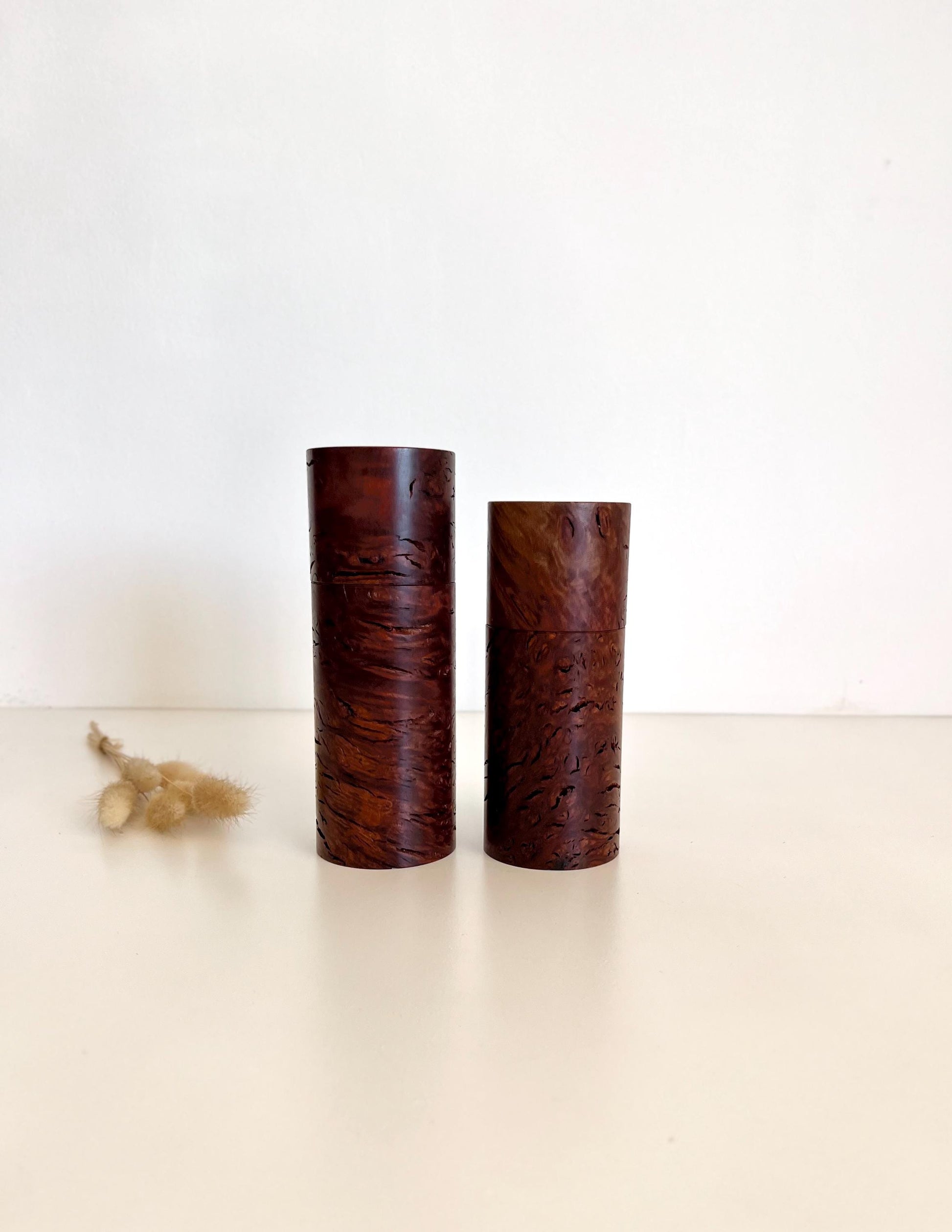 Wooden cylindrical shape salt and pepper grinders made from Australian Jarrah Burl timber