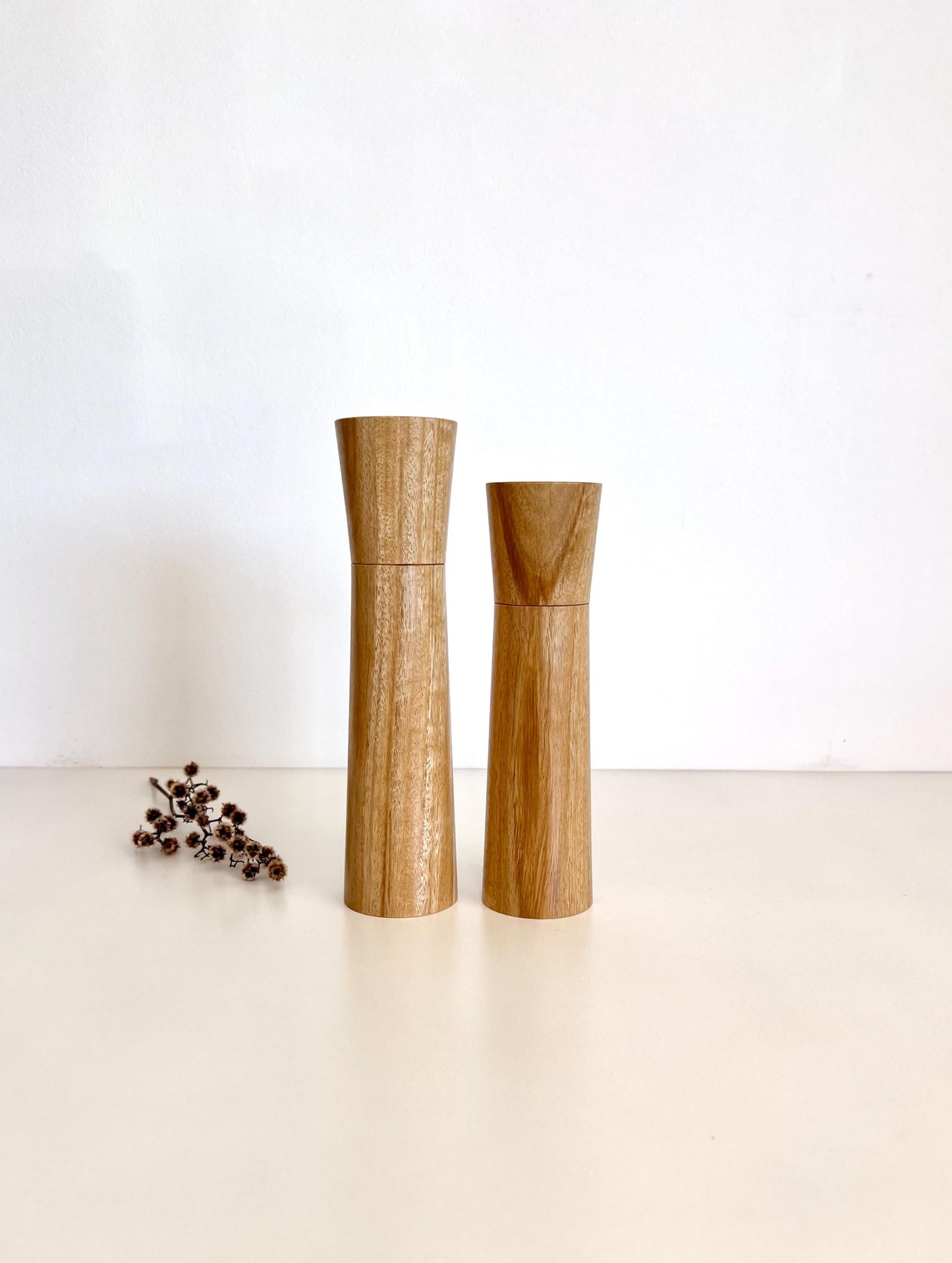 Wooden cylindrical shape salt and pepper grinders made from Bluegum timber