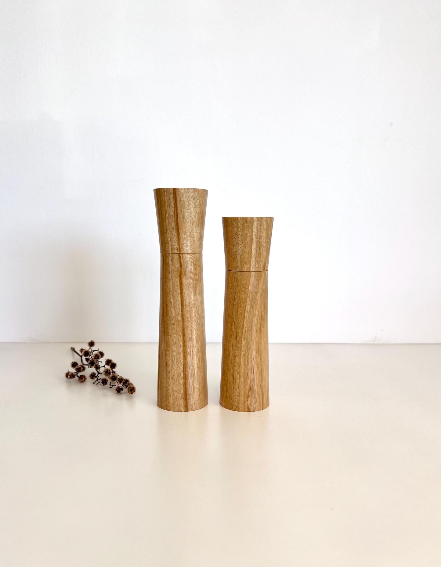 Wooden cylindrical shape salt and pepper grinders made from Bluegum timber