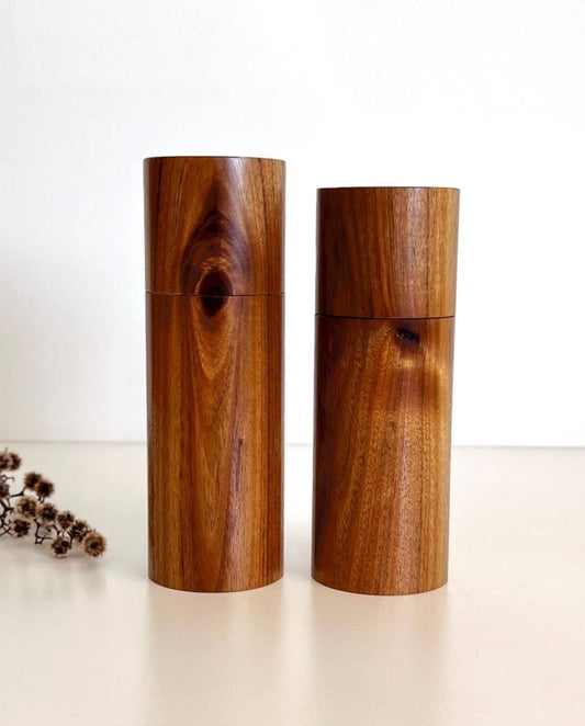 Wooden cylindrical shape salt and pepper grinders made from Black Wattle timber