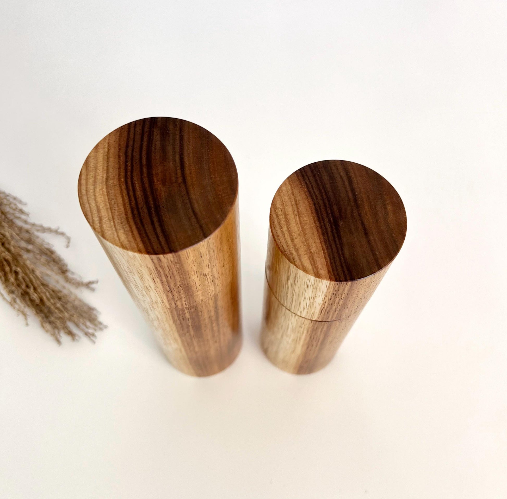 Birdseye view of wooden cylindrical shape salt and pepper grinders made from Australian Blackwood timber