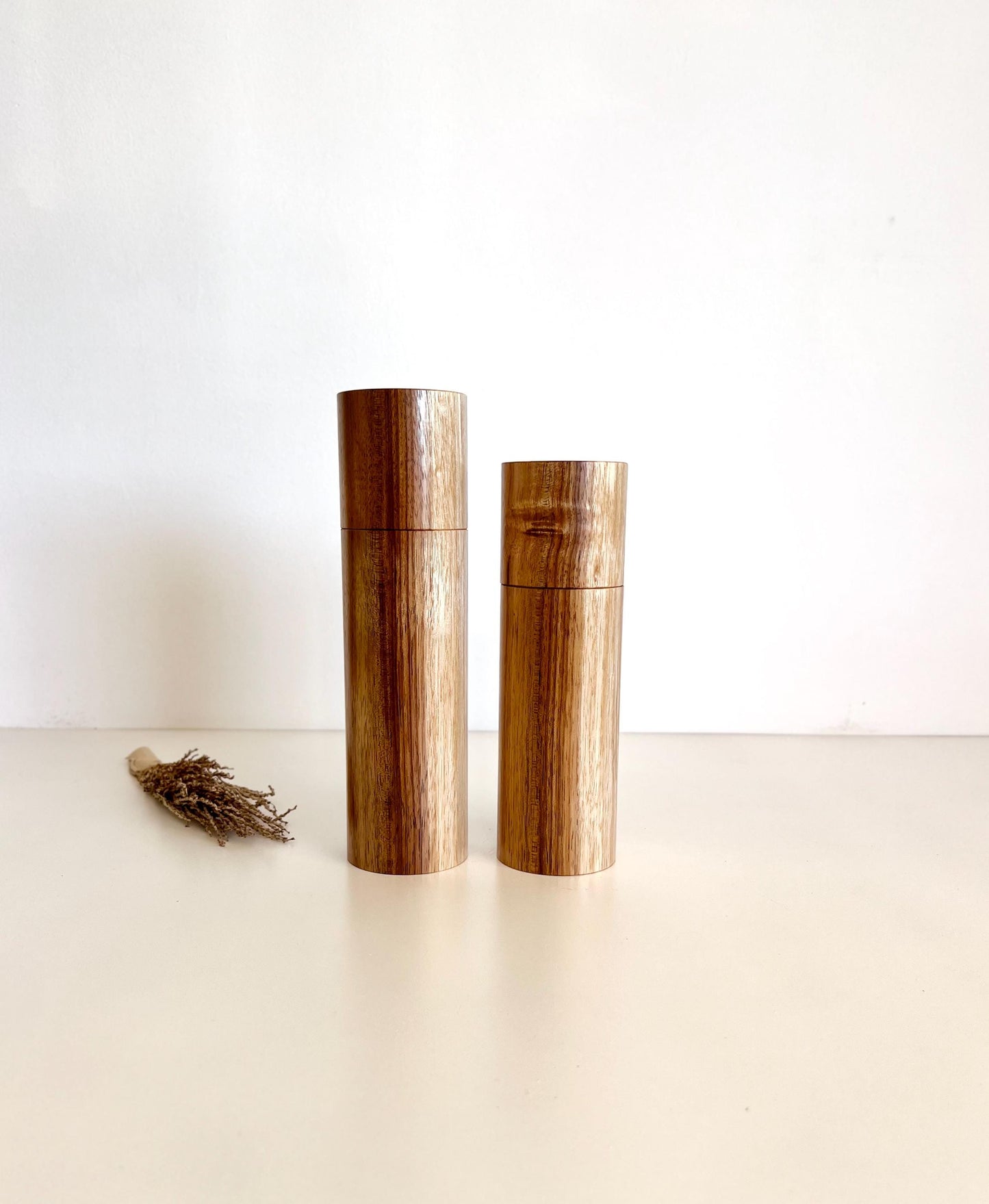 Wooden cylindrical shape salt and pepper grinders made from Blackwood timber