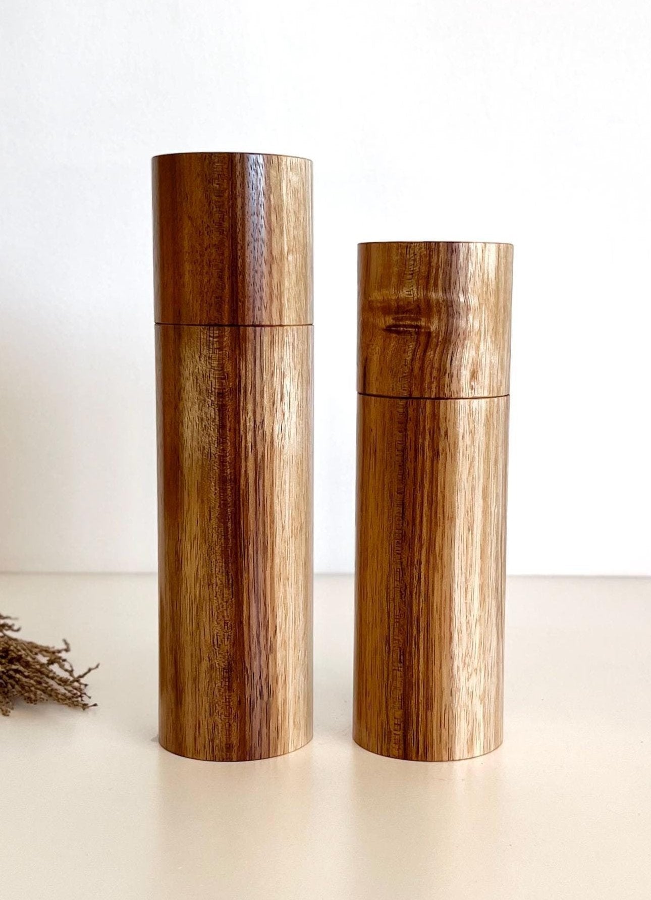 Wooden cylindrical shape salt and pepper grinders made from Blackwood timber