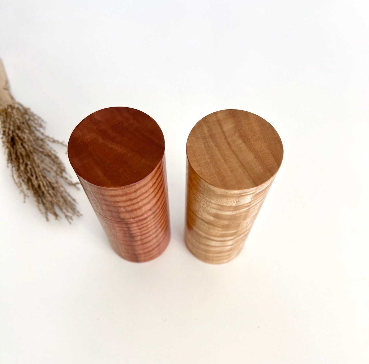 Birdseye view of wooden cylindrical shape salt and pepper grinders made from Marri and Wandoo timbers