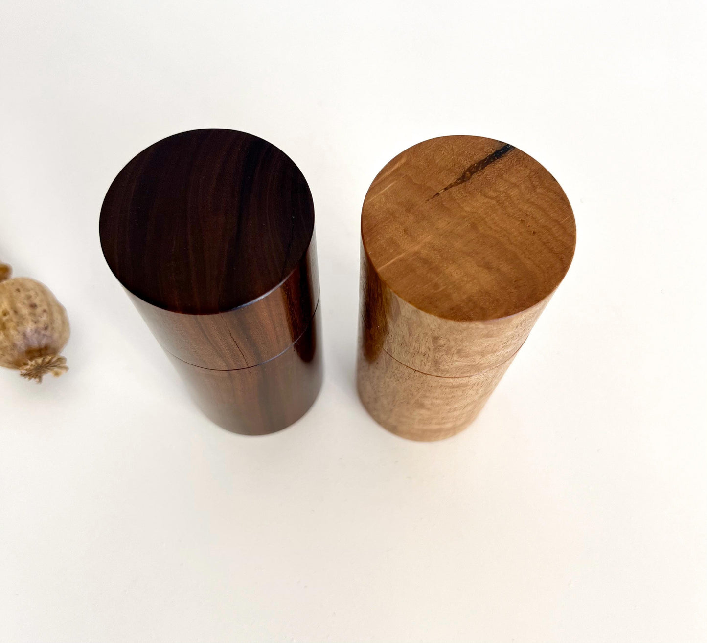 Birdseye view of wooden cylindrical shape salt and pepper grinders made from Gidgee and Blackbutt timbers