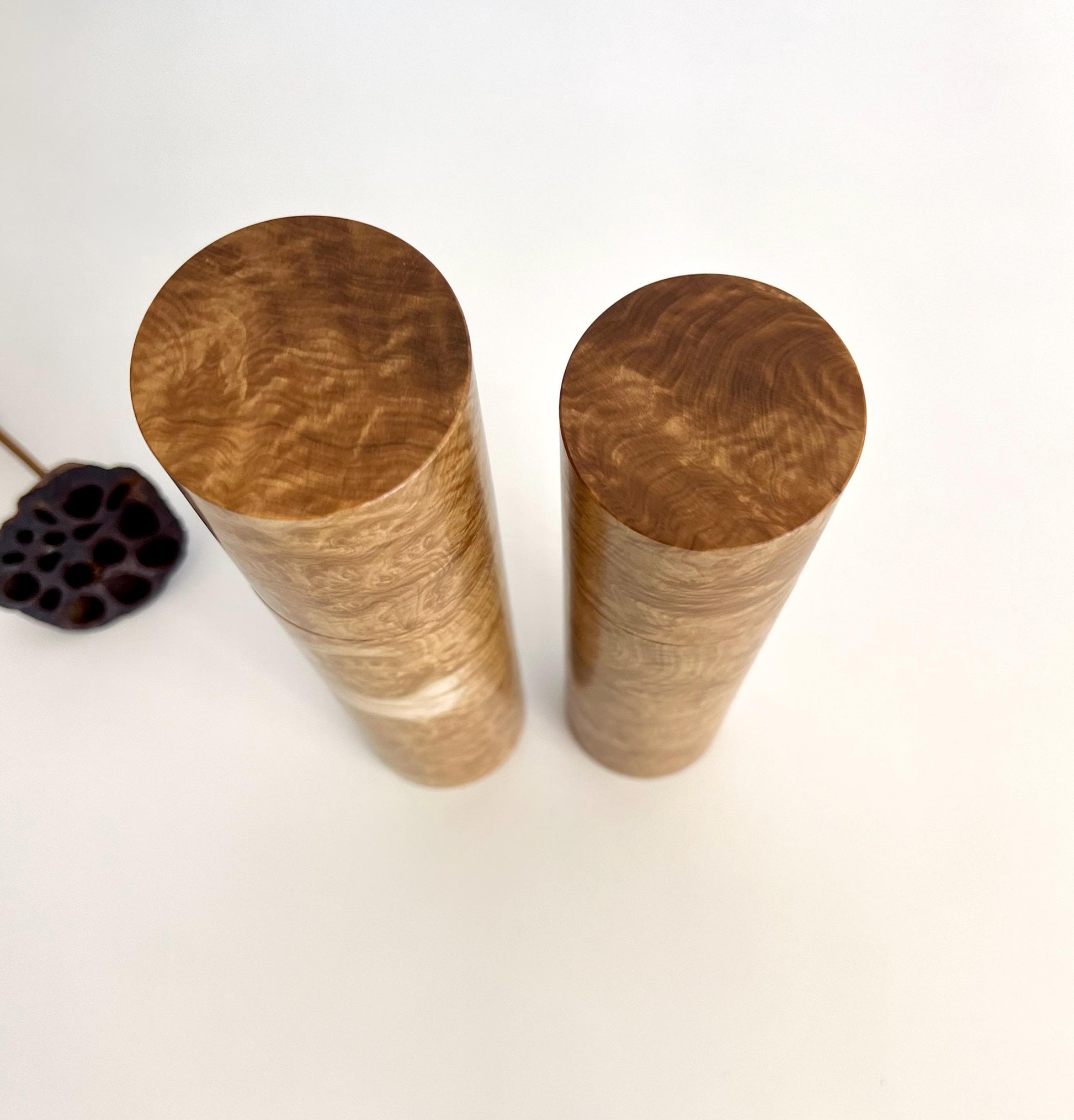 Birdseye view of wooden cylindrical shape salt and pepper grinders made from Australian Yorrell burl timber