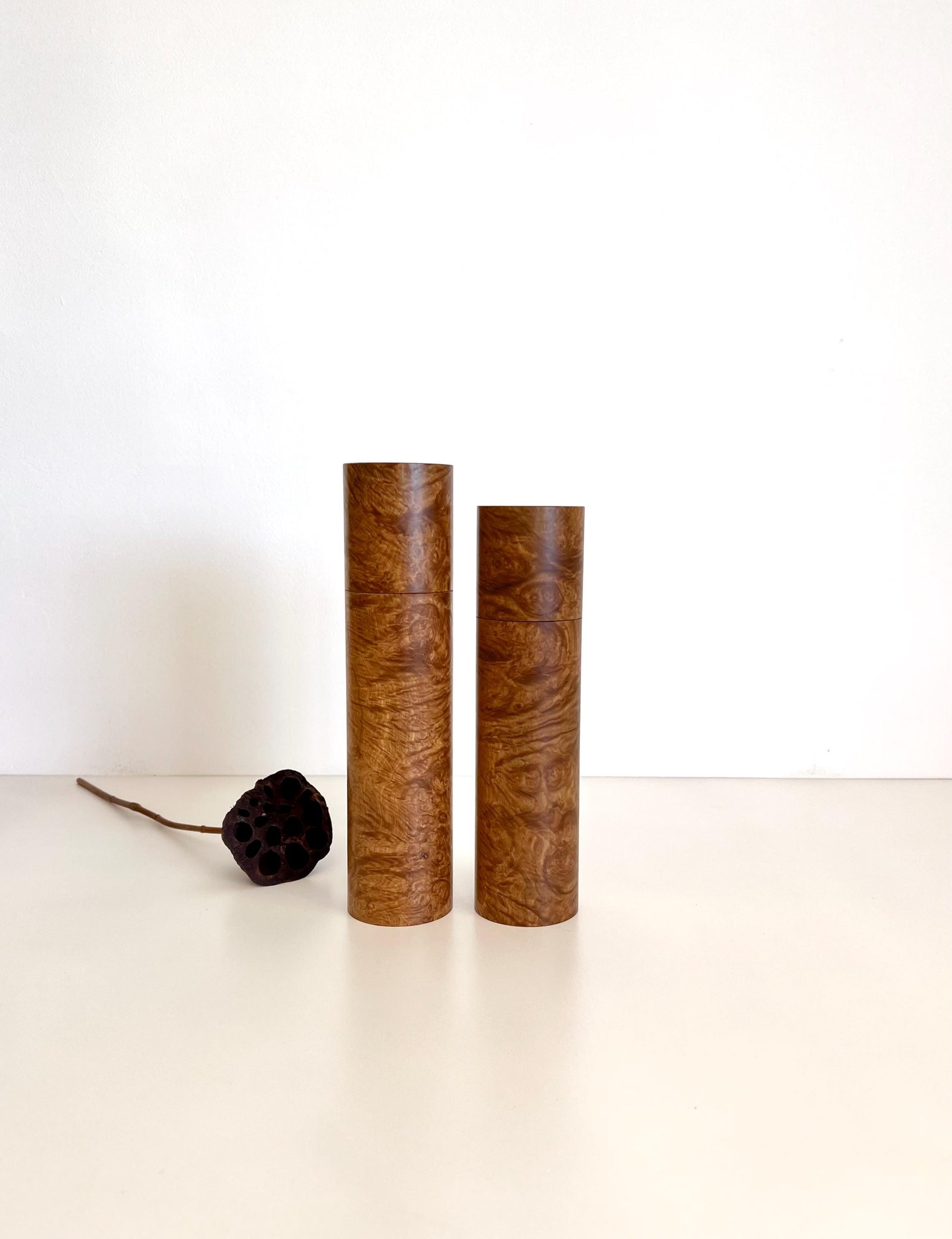 Wooden cylindrical shape salt and pepper grinders made from Australian Yorrel burl timber