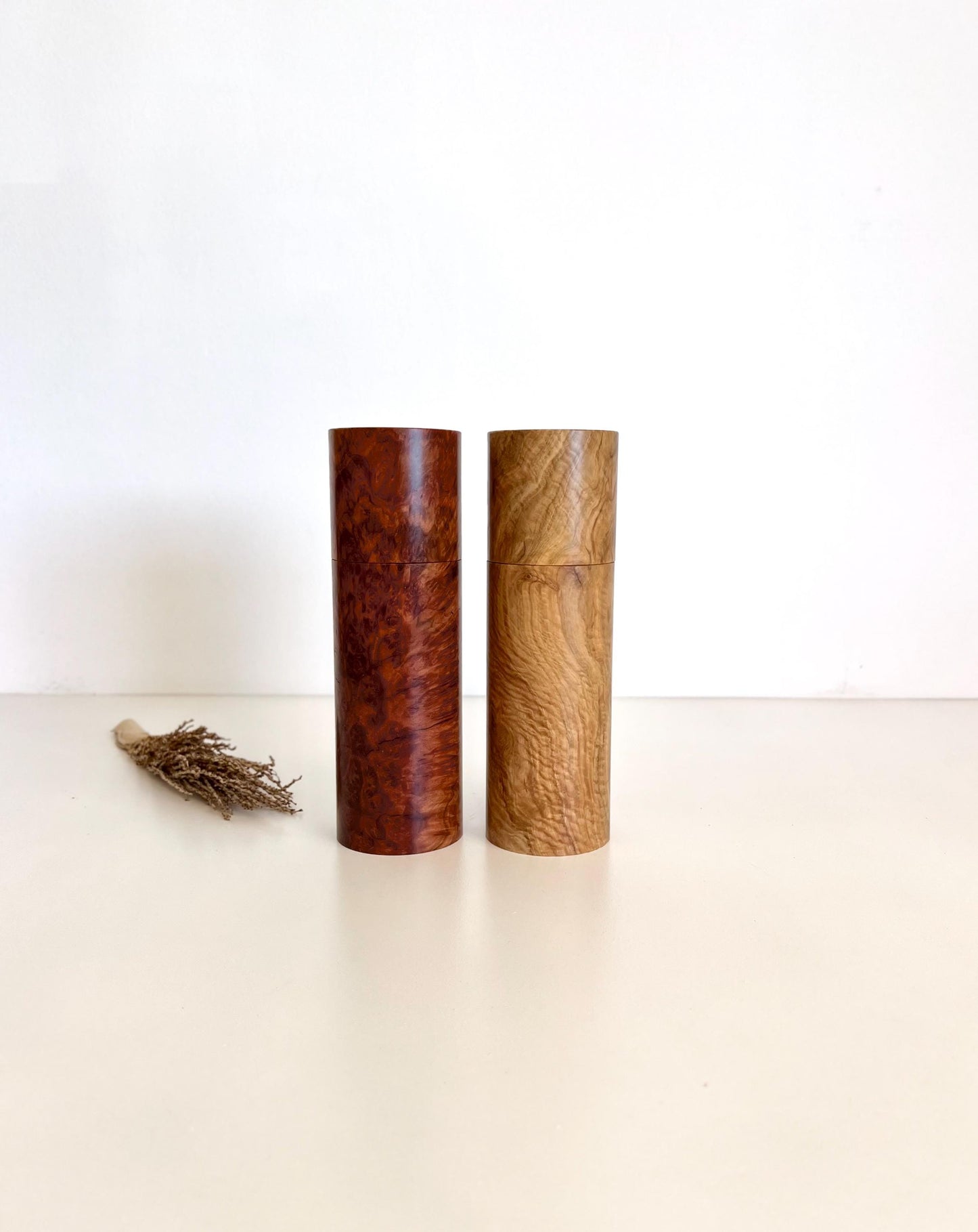 Wooden cylindrical shape salt and pepper grinders made from Australian burl timber