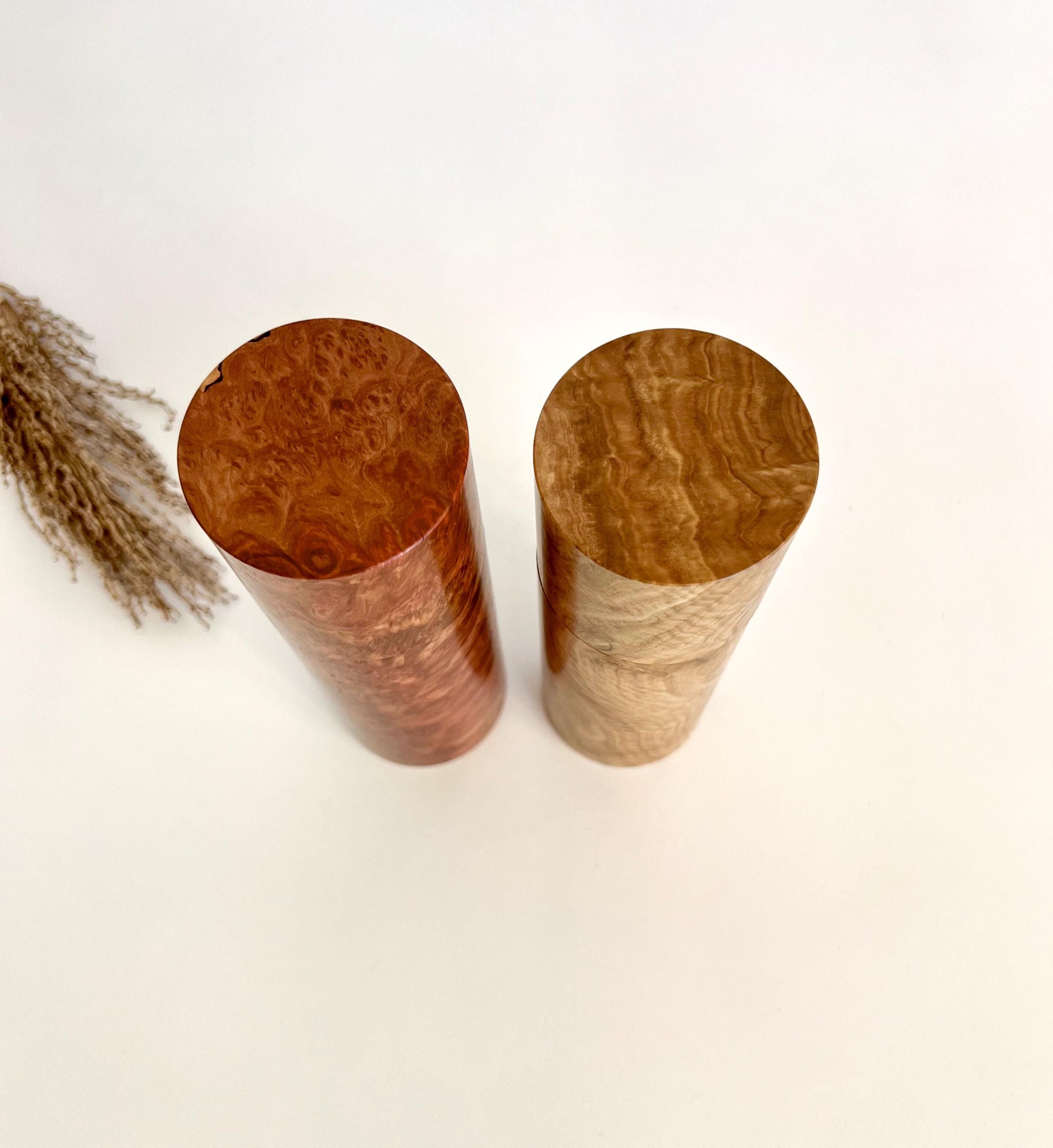 Birdseye view of wooden cylindrical shape salt and pepper grinders made from Australian burl timber