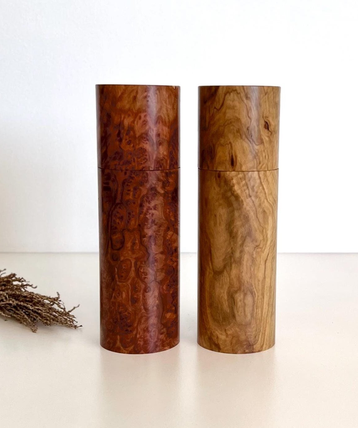 Wooden cylindrical shape salt and pepper grinders made from Australian burl timber