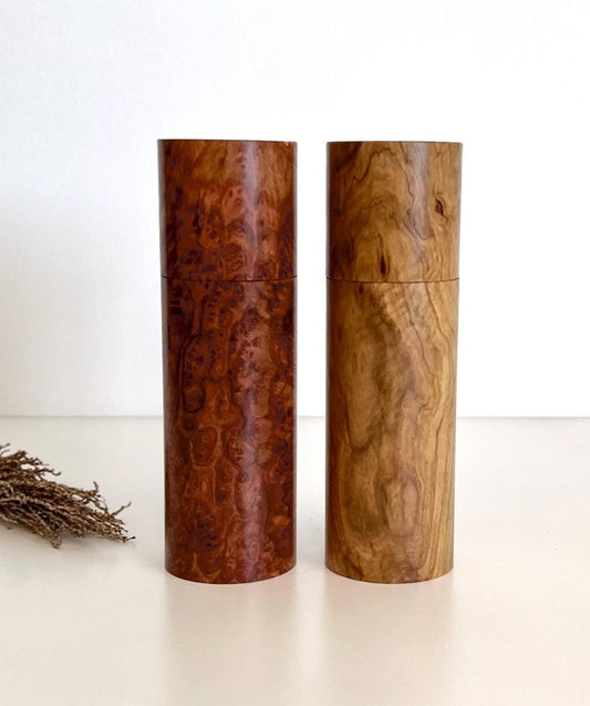 Wooden cylindrical shape salt and pepper grinders made from Australian burl timber