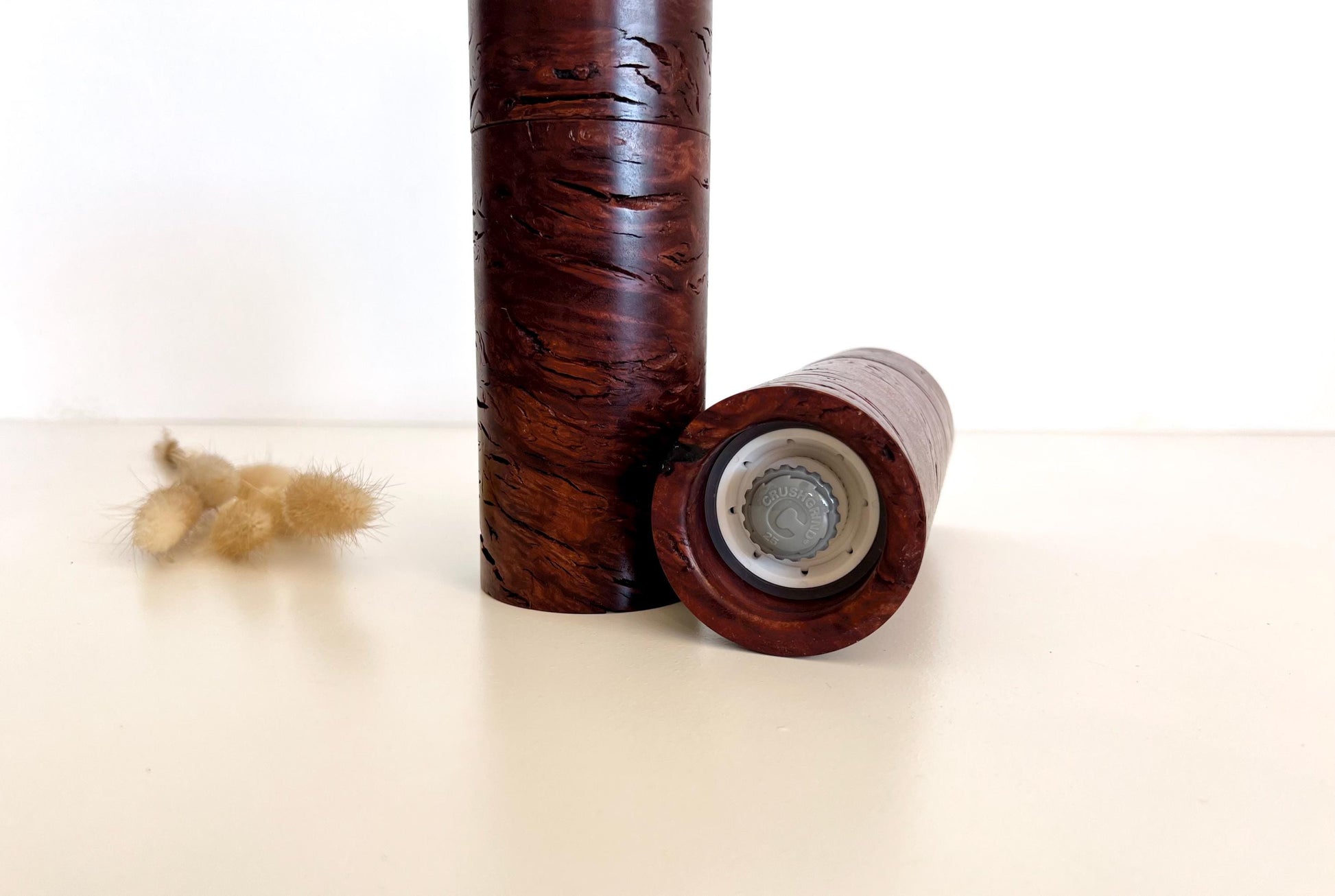 Bottom of salt and pepper grinder showing Crushgrind ceramic grinding mechanism and the adjustment knob