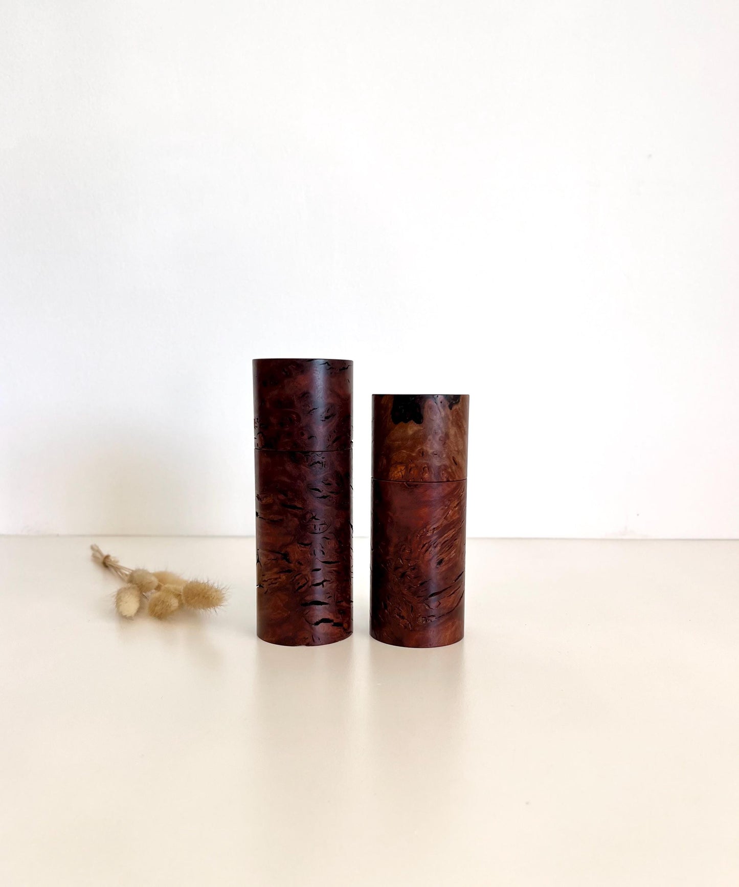 Wooden cylindrical shape salt and pepper grinders made from Australian Jarrah Burl timber