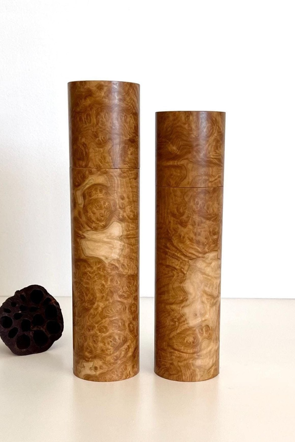 Wooden cylindrical shape salt and pepper grinders made from Australian Yorrel burl timber