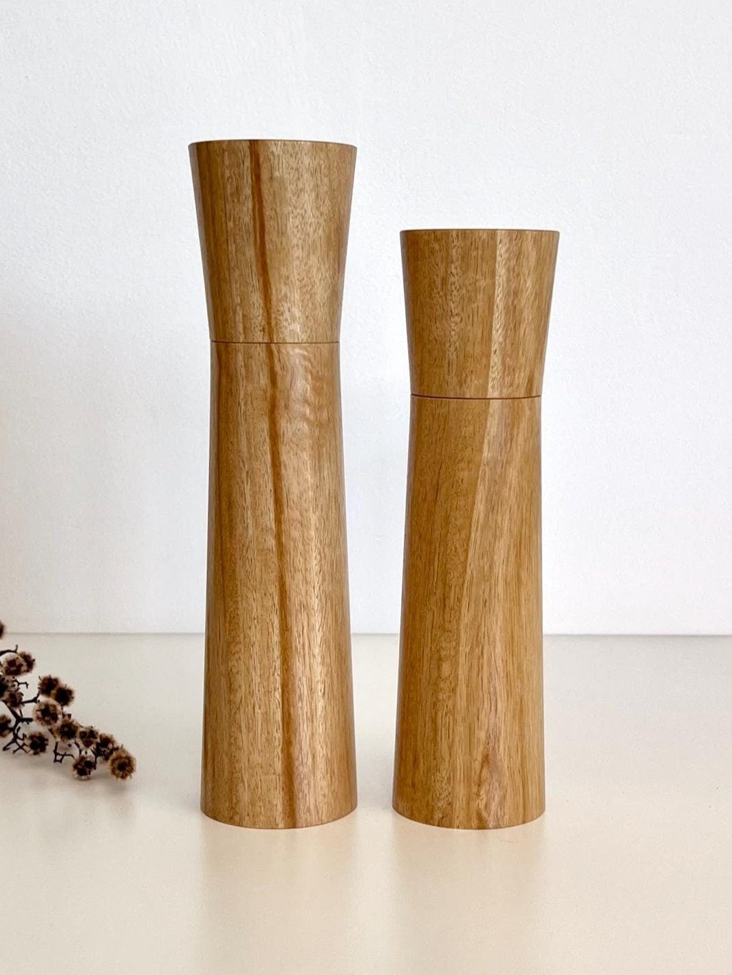 Wooden cylindrical shape salt and pepper grinders made from Bluegum timber