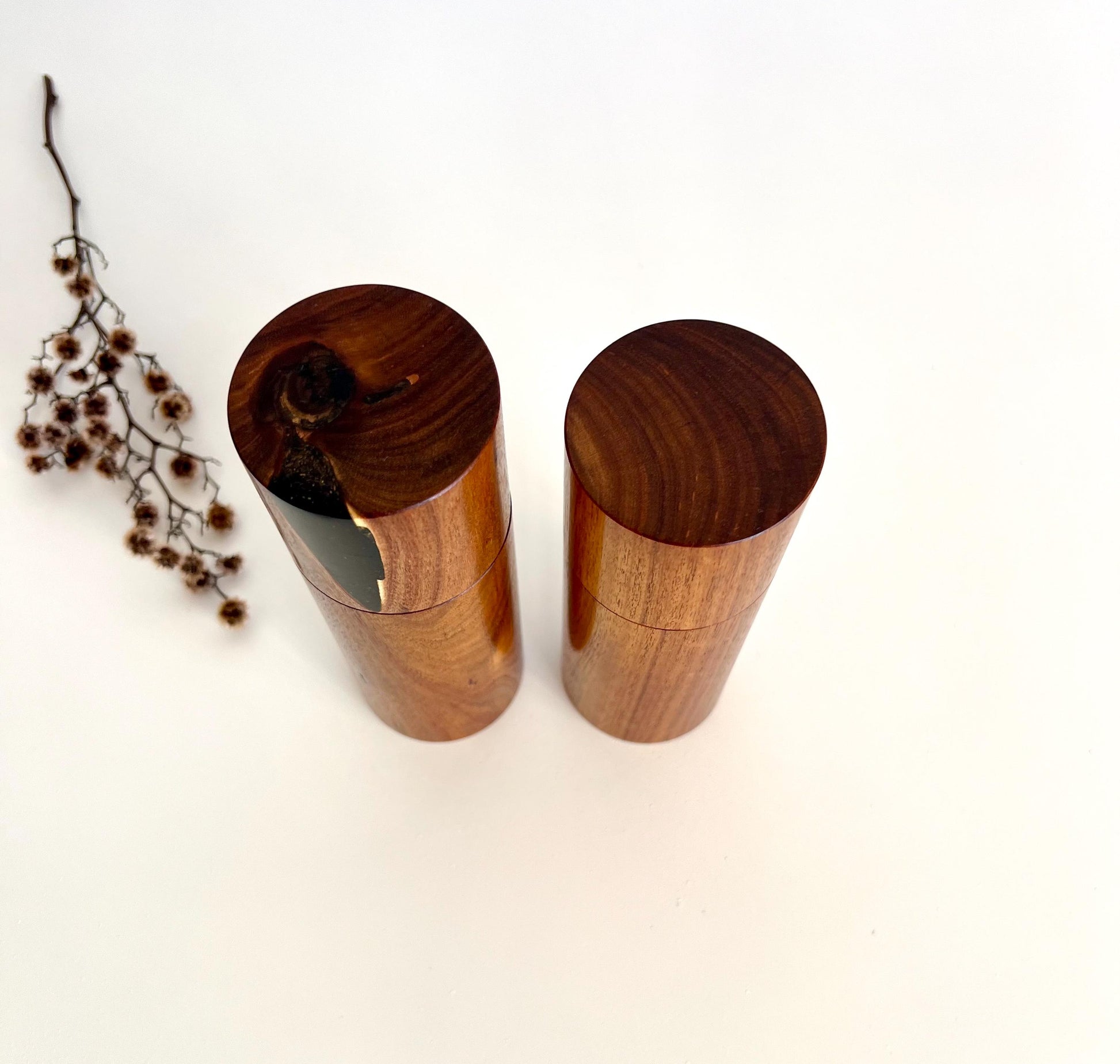 Birdseye view of wooden cylindrical shape salt and pepper grinders made from Australian Black Wattle timber