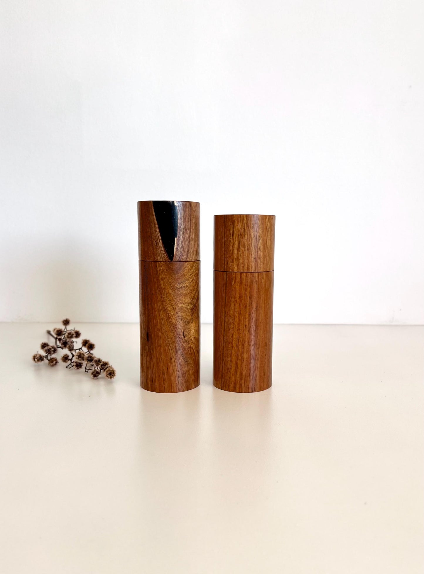 Wooden cylindrical shape salt and pepper grinders made from Black Wattle timber