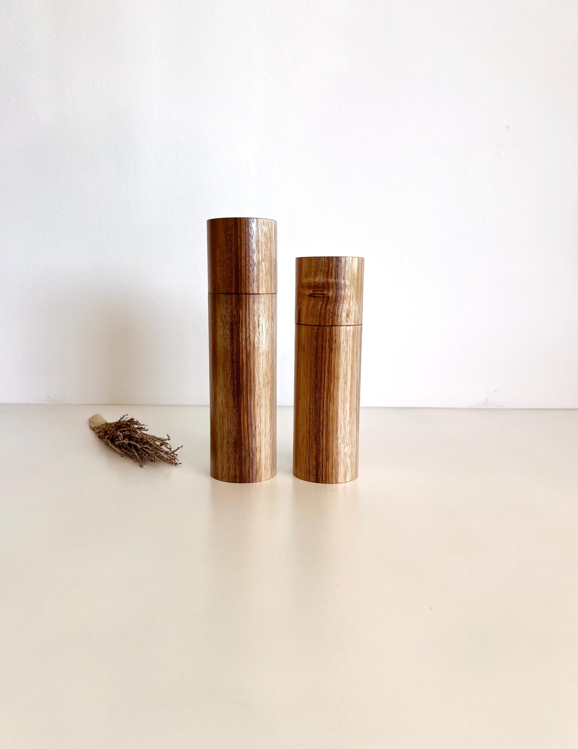 Wooden cylindrical shape salt and pepper grinders made from Blackwood timber