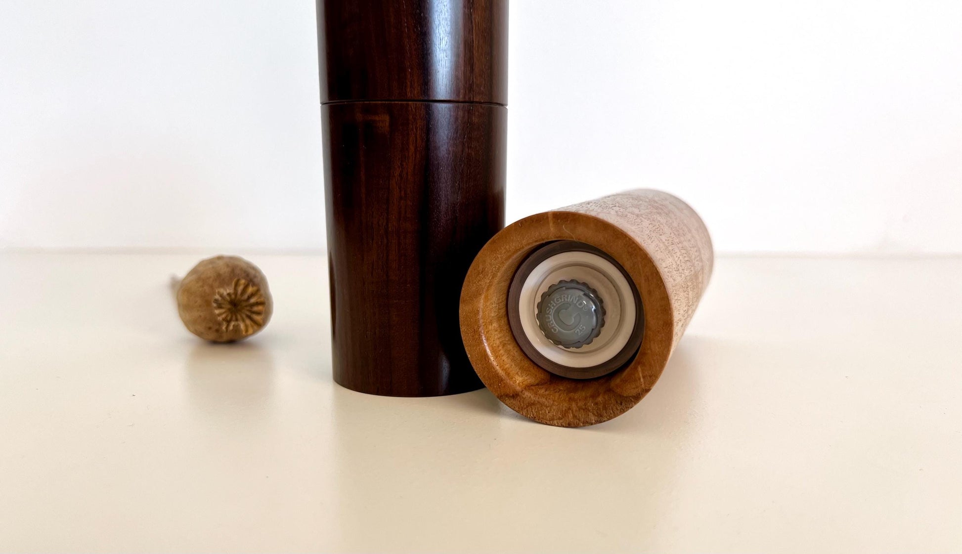 Bottom of salt and pepper grinder showing Crushgrind ceramic grinding mechanism and the adjustment knob