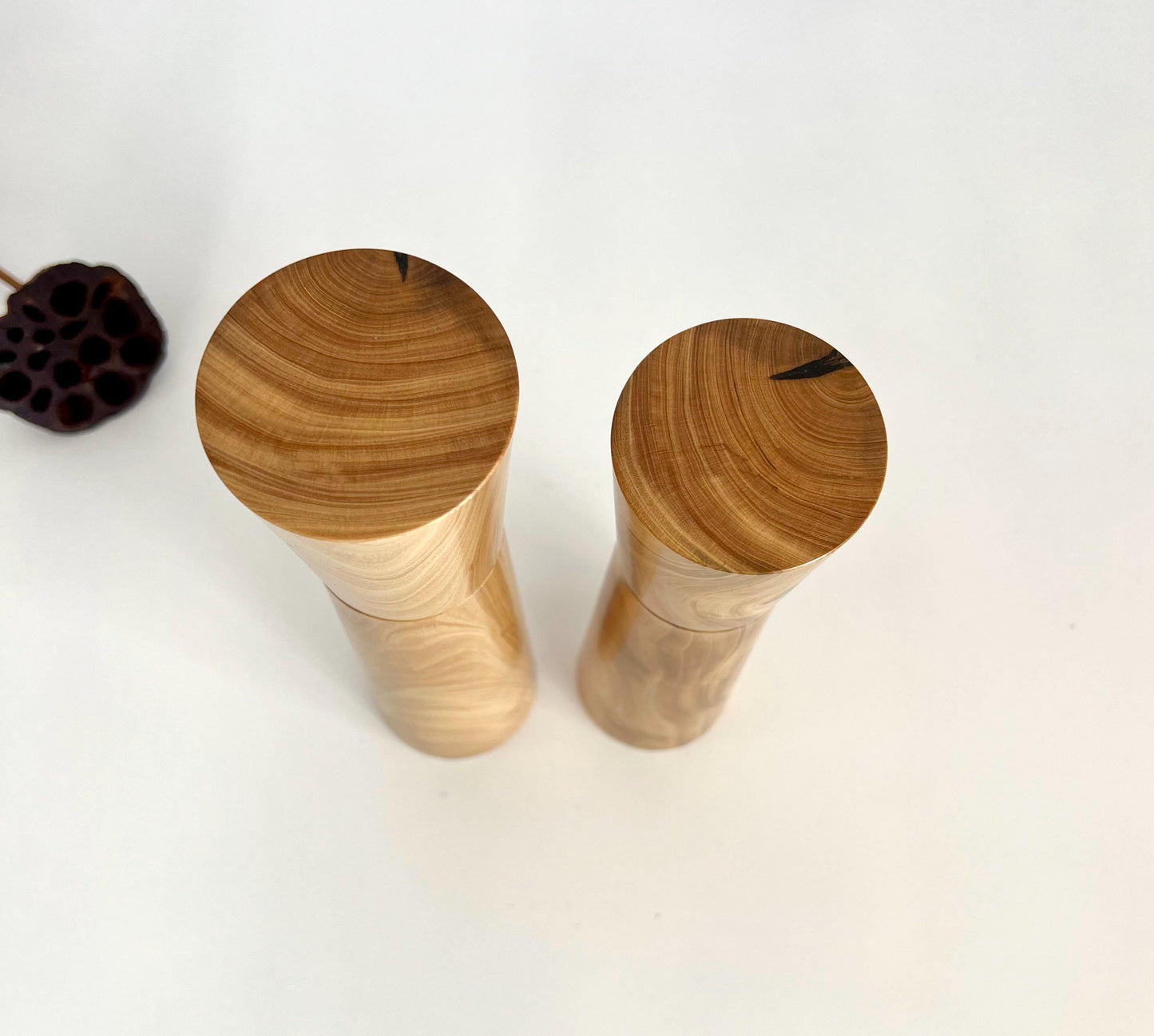 Birdseye view of wooden tapered cylindrical shape salt and pepper grinders made from Australian Wilga timber