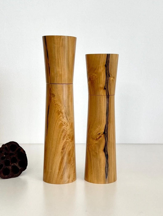 Wooden cylindrical shape salt and pepper grinders made from Australian Wilga timber.