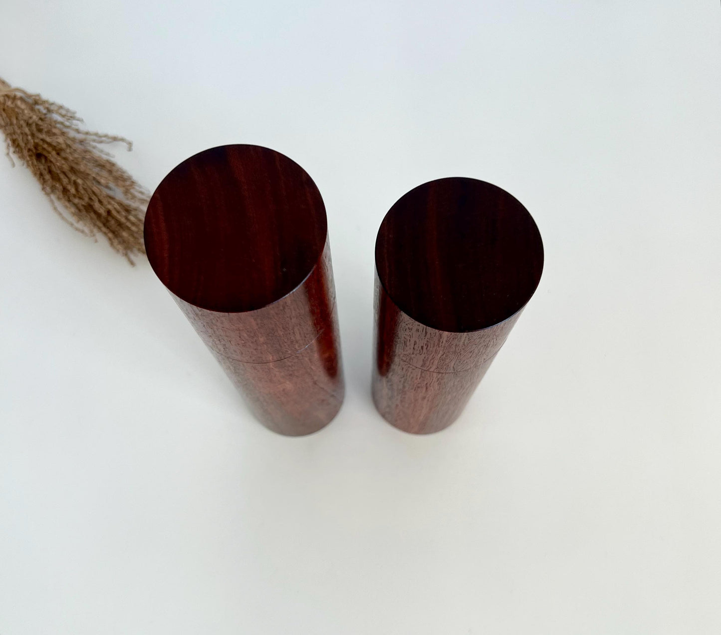 Birdseye view of wooden cylindrical shape salt and pepper grinders made from Australian Jarrah timber