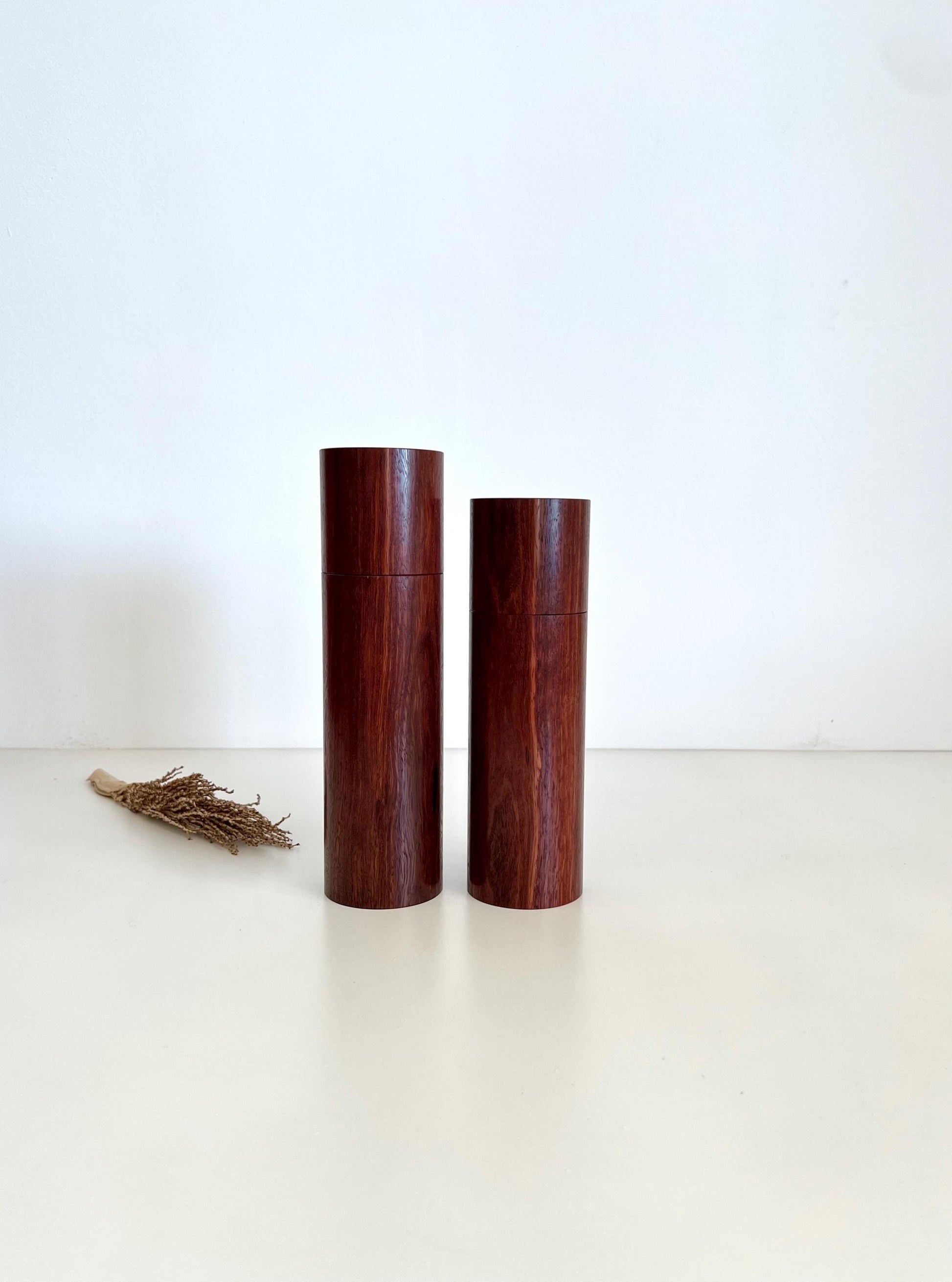 Wooden cylindrical shape salt and pepper grinders made from Australian Jarrah timber.