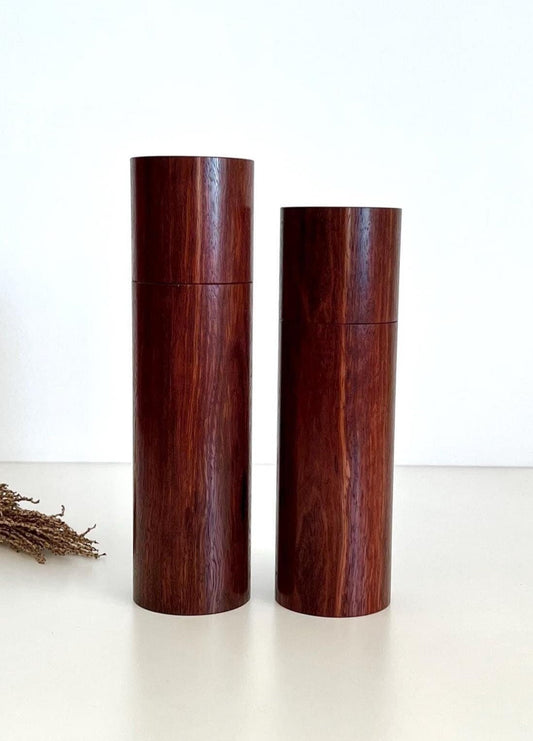 Wooden cylindrical shape salt and pepper grinders made from Australian Jarrah timber.