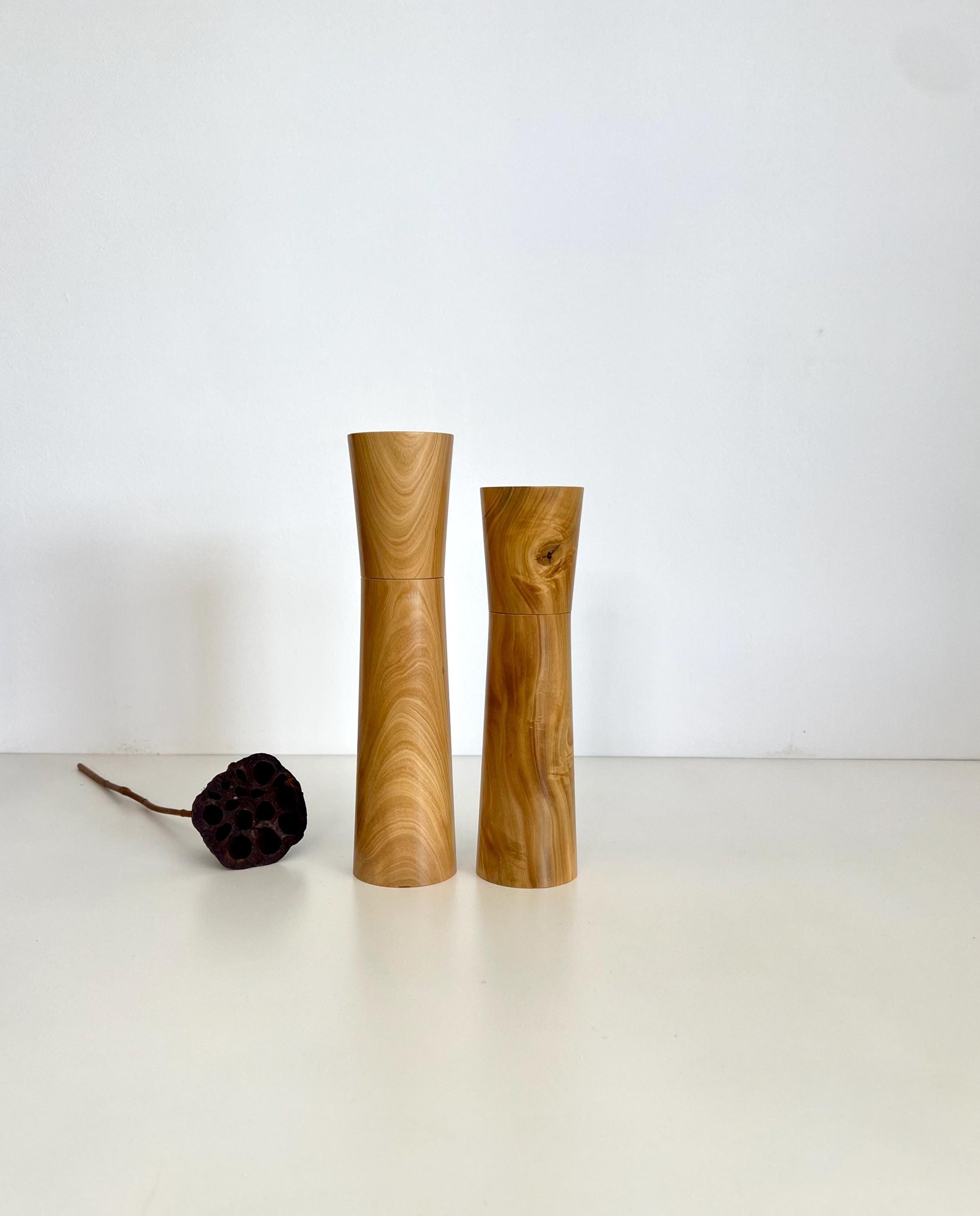 Wooden cylindrical tapered shape salt and pepper grinders made from Australian Wilga timber.