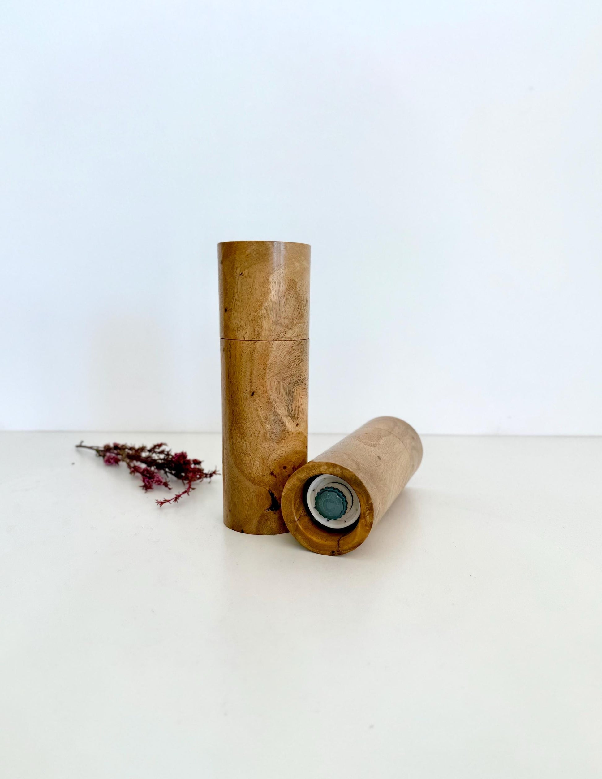 Bottom of salt and pepper grinder showing Crushgrind ceramic grinding mechanism and the adjustment knob
