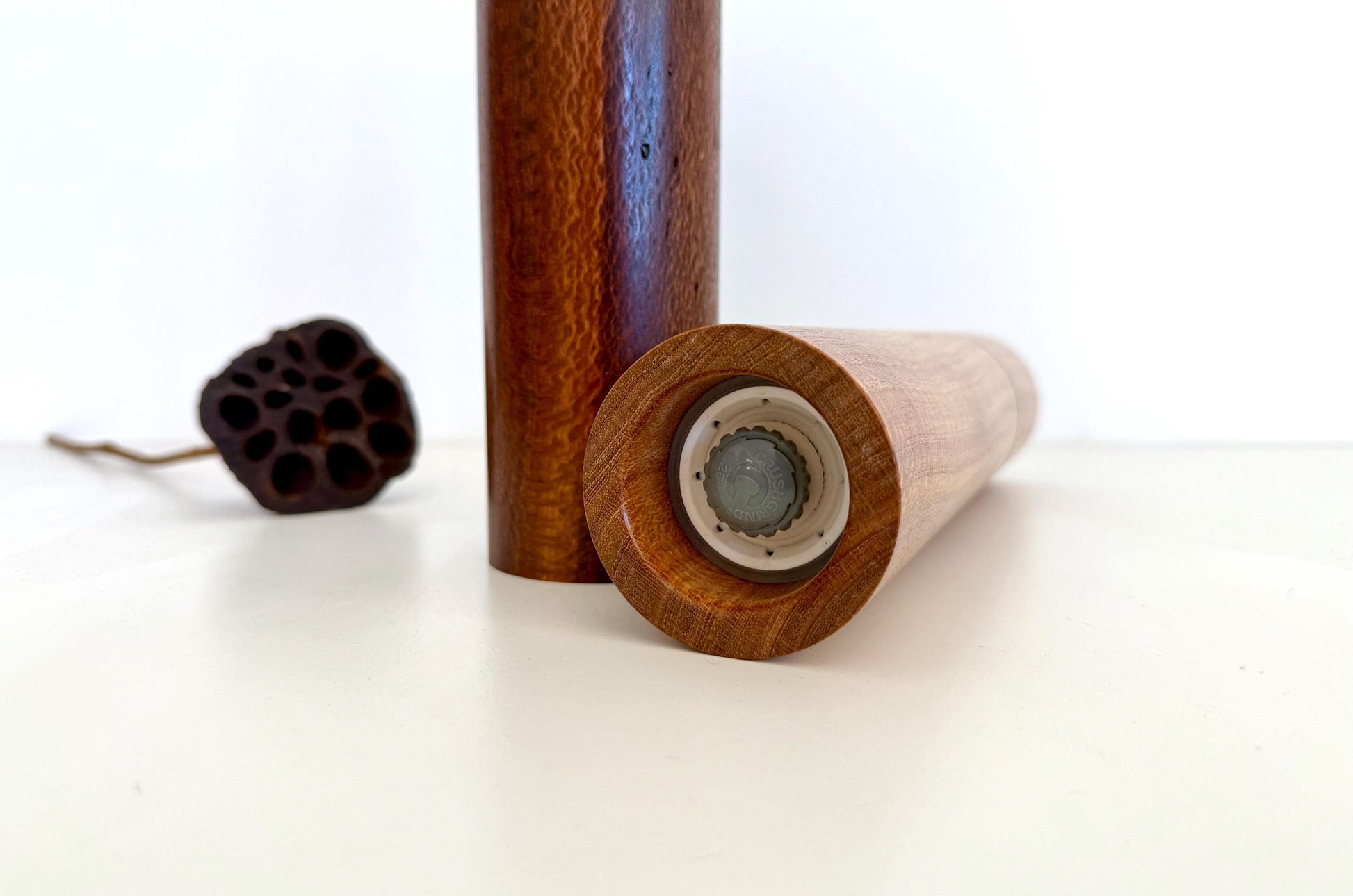 Bottom of salt and pepper grinder showing Crushgrind ceramic grinding mechanism and the adjustment knob