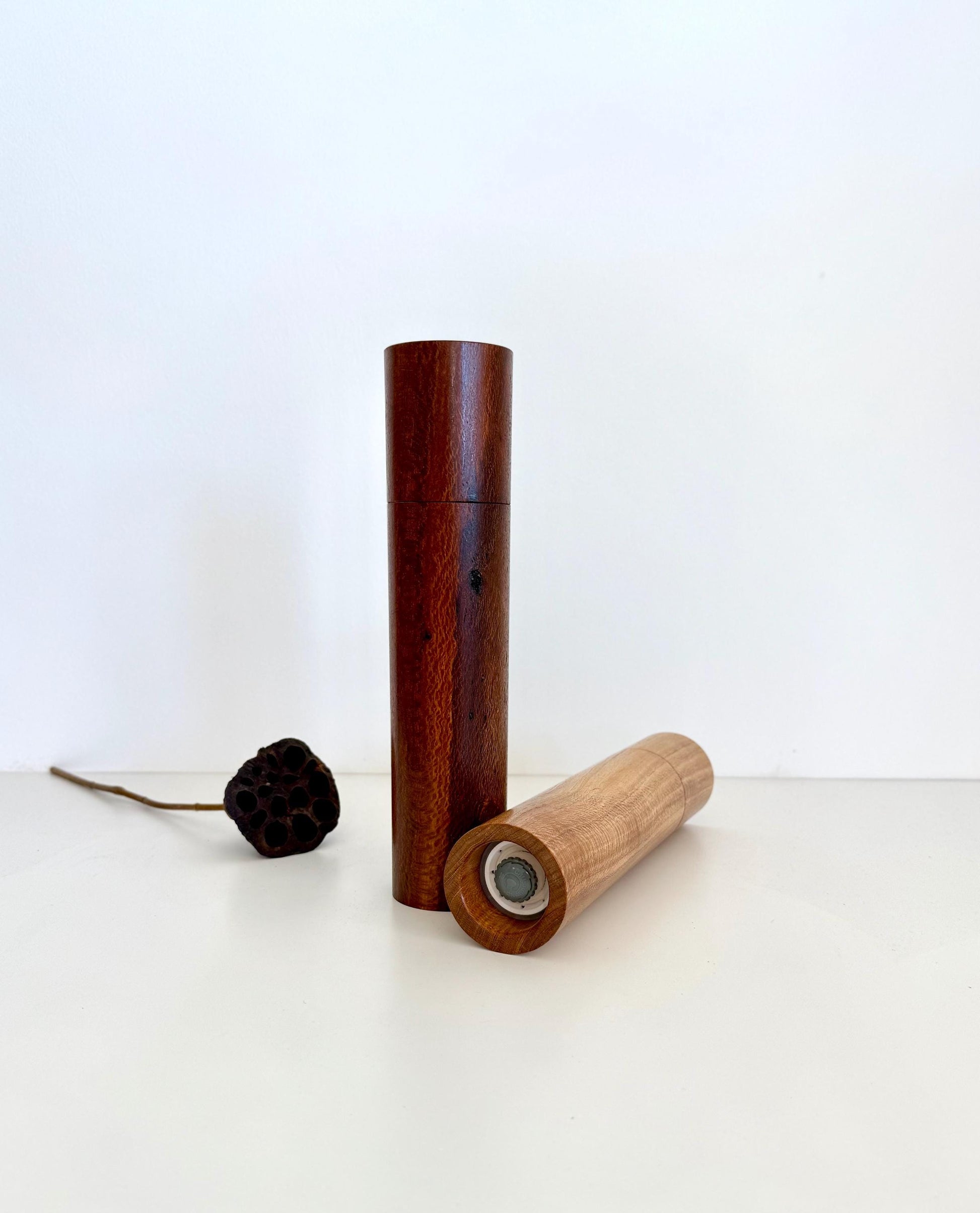 Bottom of salt and pepper grinder showing Crushgrind ceramic grinding mechanism and the adjustment knob