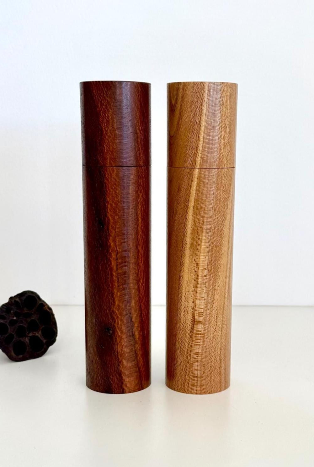 Wooden cylindrical shape salt and pepper grinders made from Banksia timber
