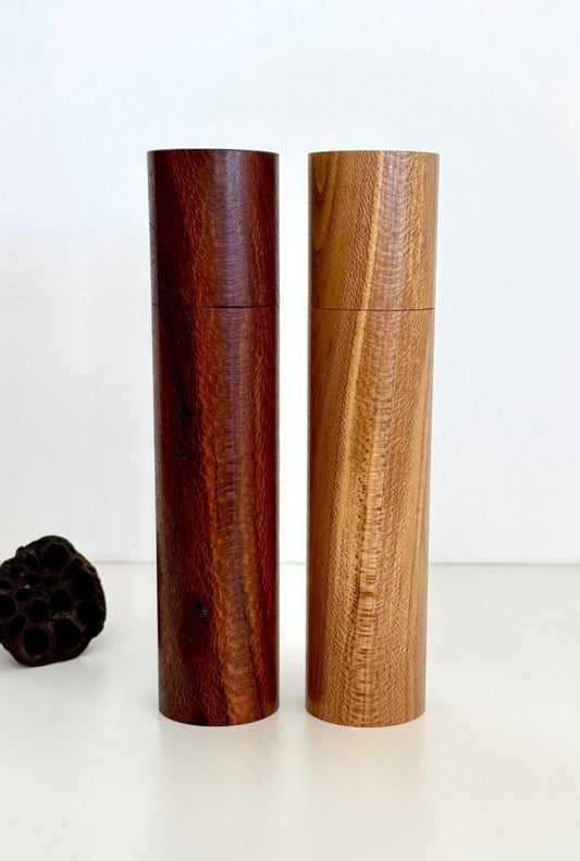 Wooden cylindrical shape salt and pepper grinders made from Banksia timber