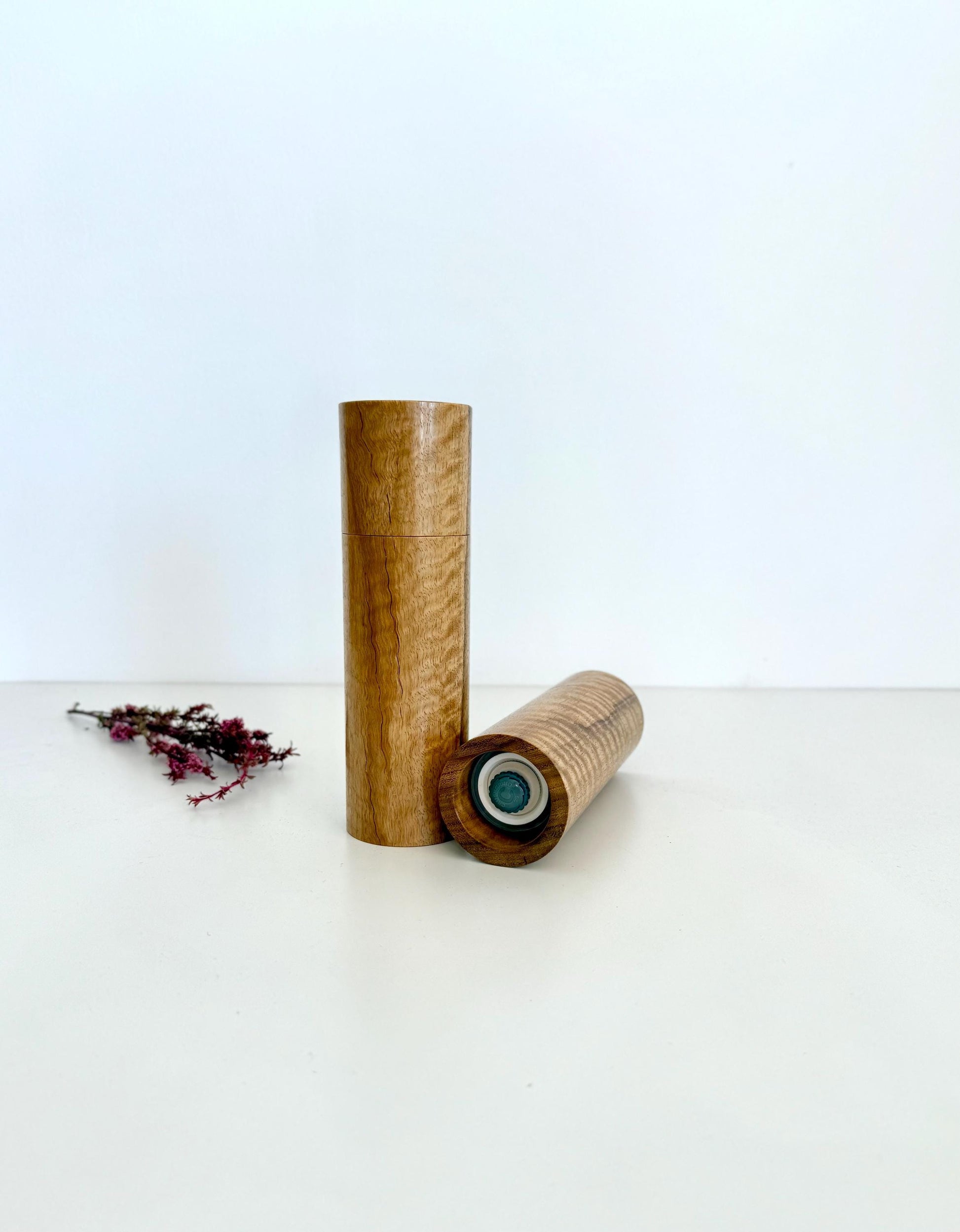 Bottom of salt and pepper grinder showing Crushgrind ceramic grinding mechanism and the adjustment knob