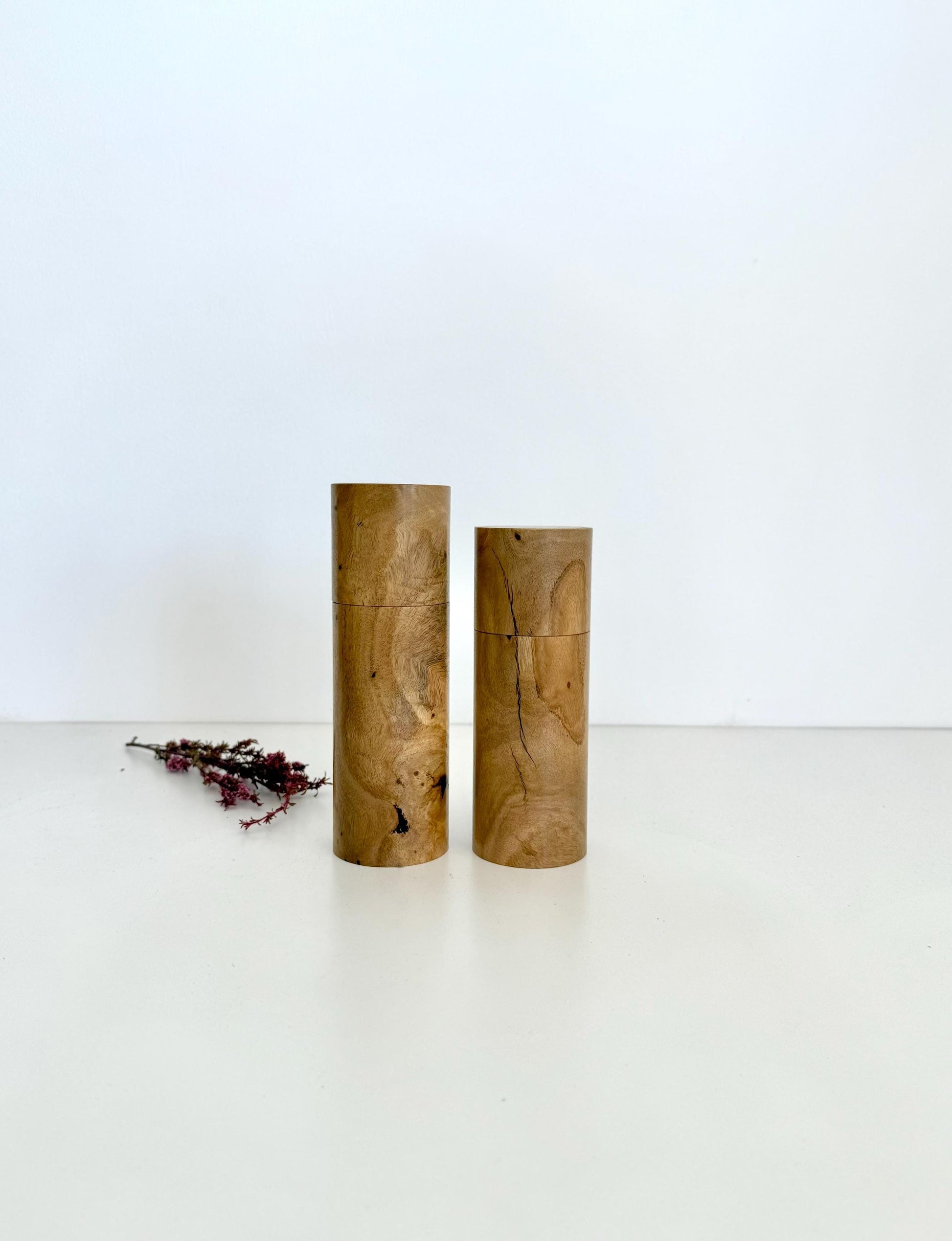Wooden cylindrical shape salt and pepper grinders made from Lemon scented gum
