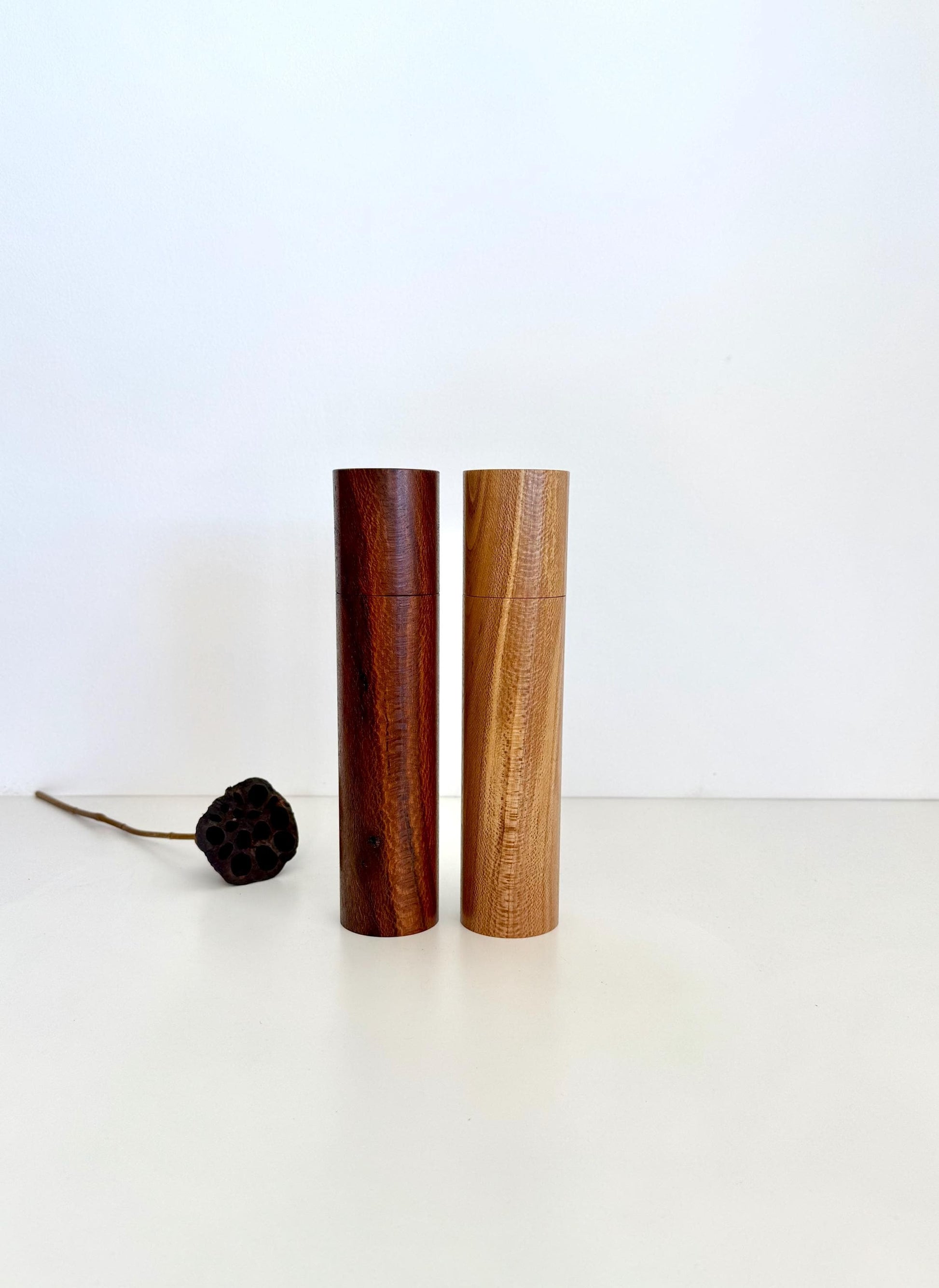 Wooden cylindrical shape salt and pepper grinders made from Banksia timber