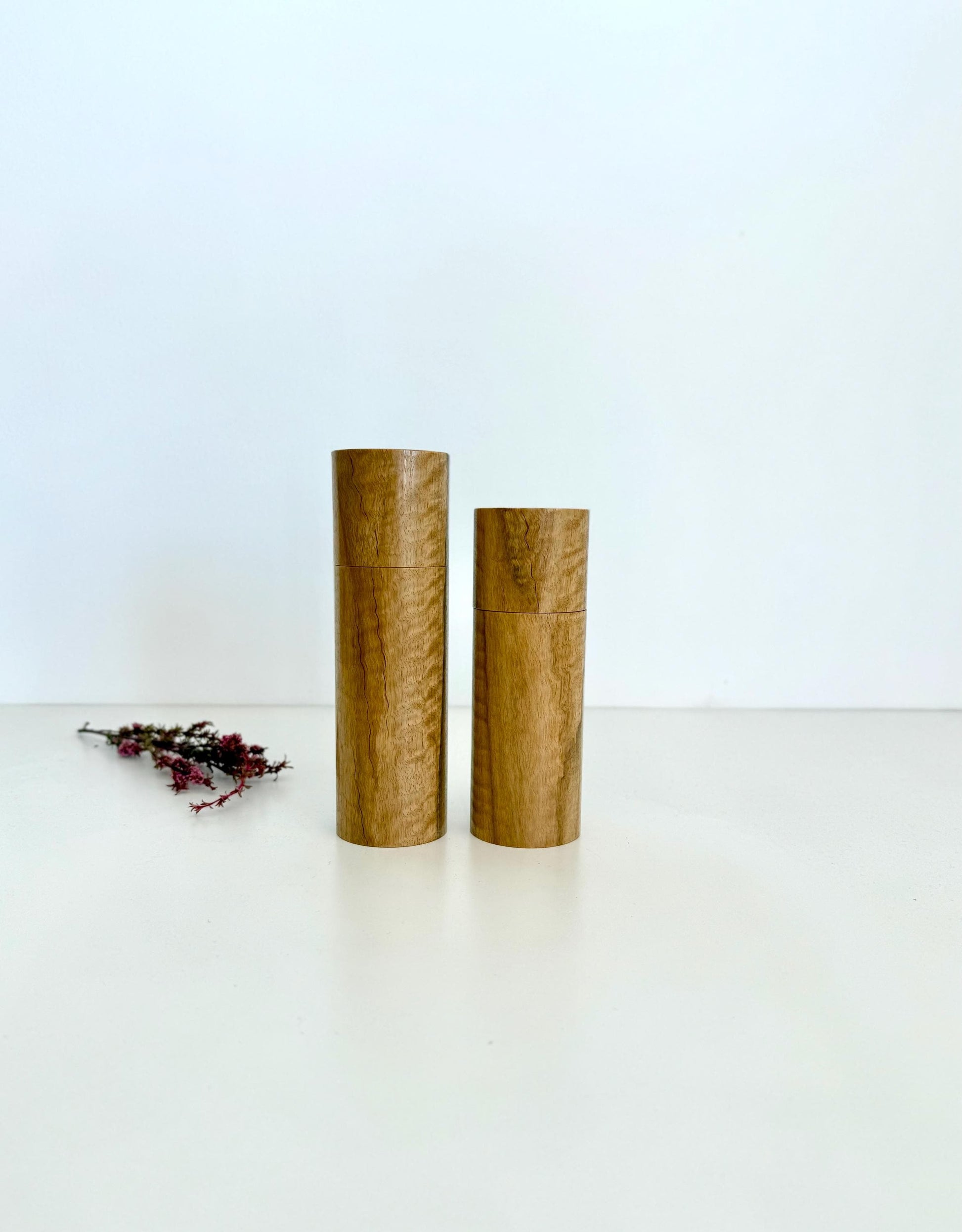 Wooden cylindrical shape salt and pepper grinders made from Marri timber