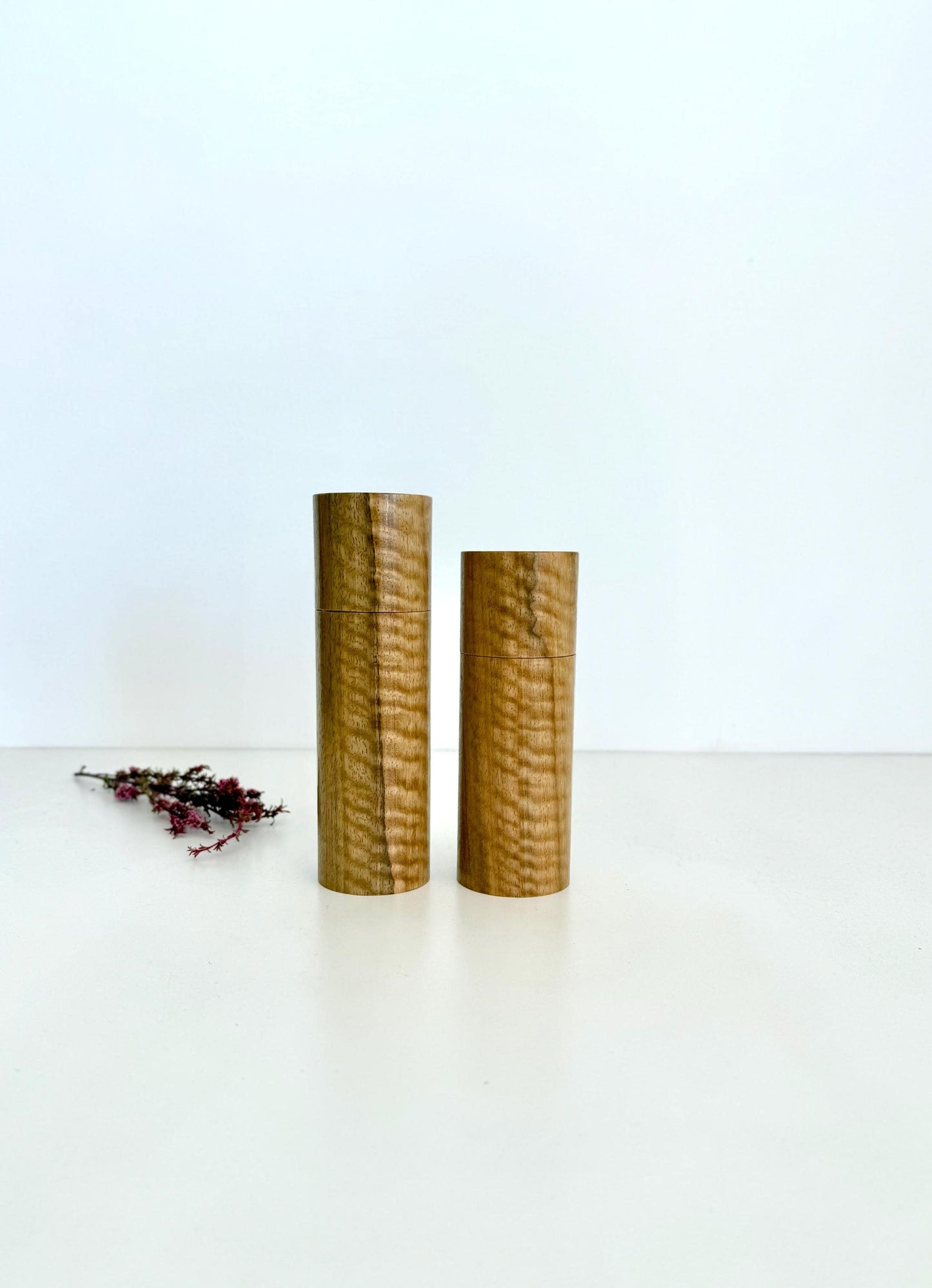 Wooden cylindrical shape salt and pepper grinders made from Marri timber